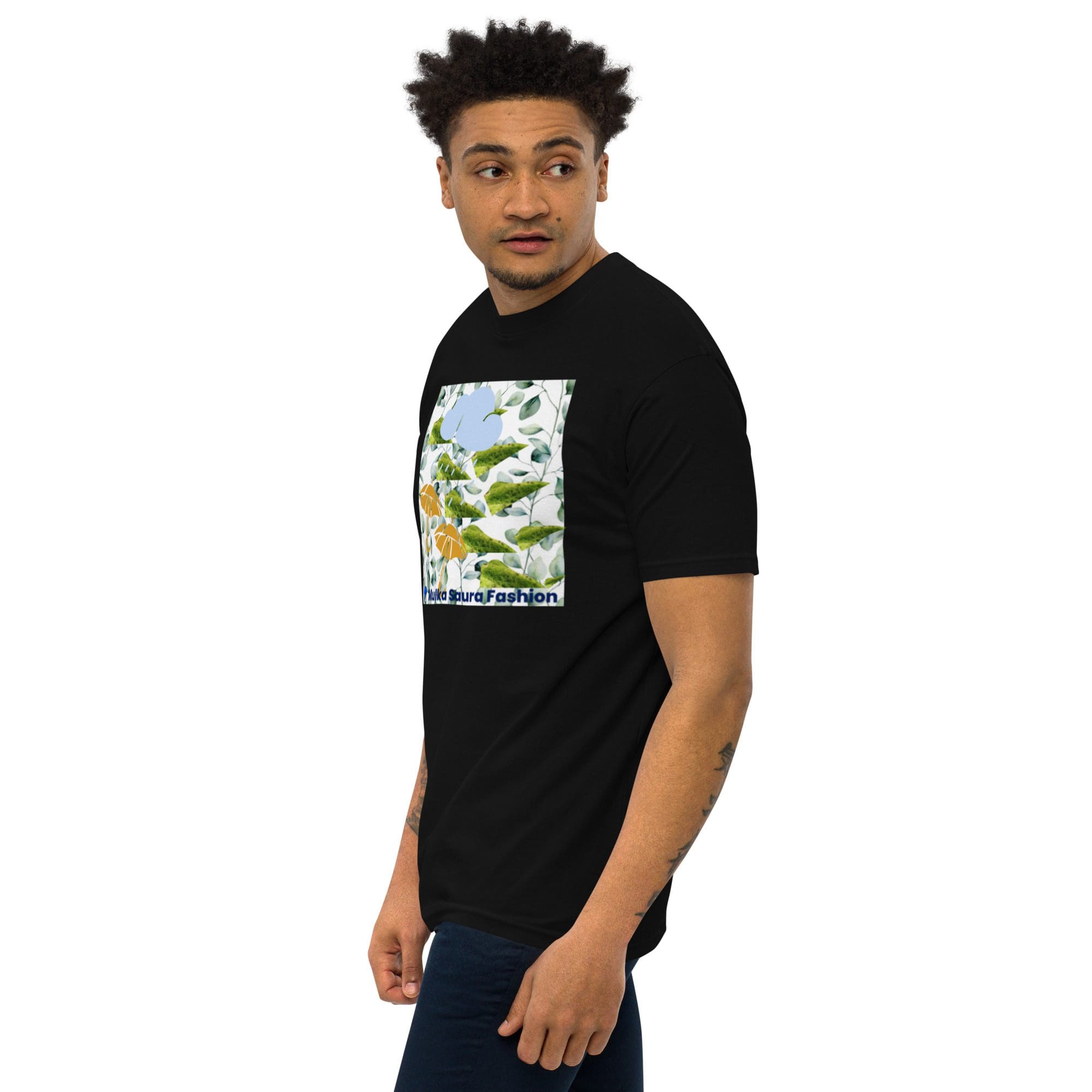 Man wearing black graphic t-shirt, looking sideways.