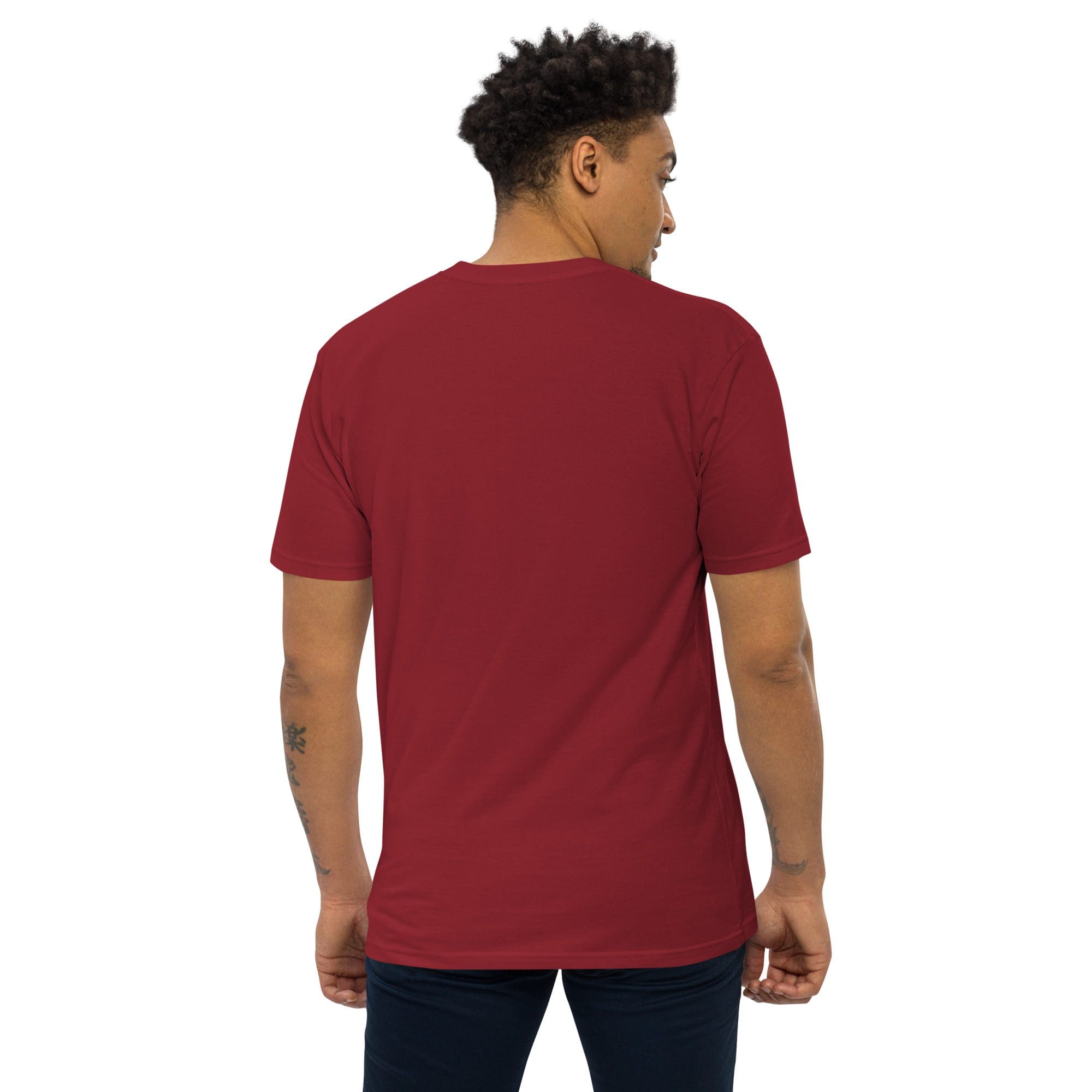 Man wearing red shirt and black pants.