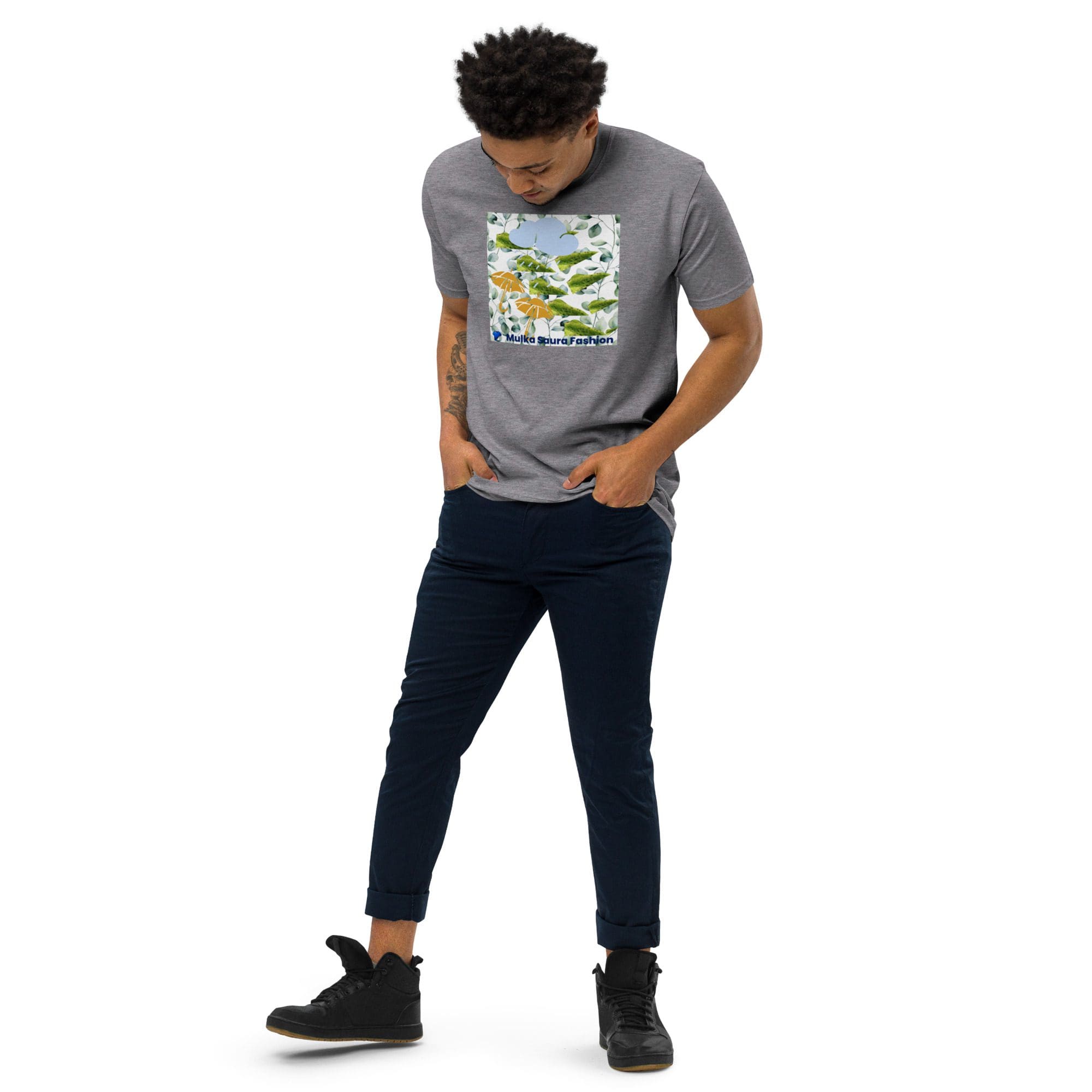 Man wearing graphic t-shirt and dark pants.