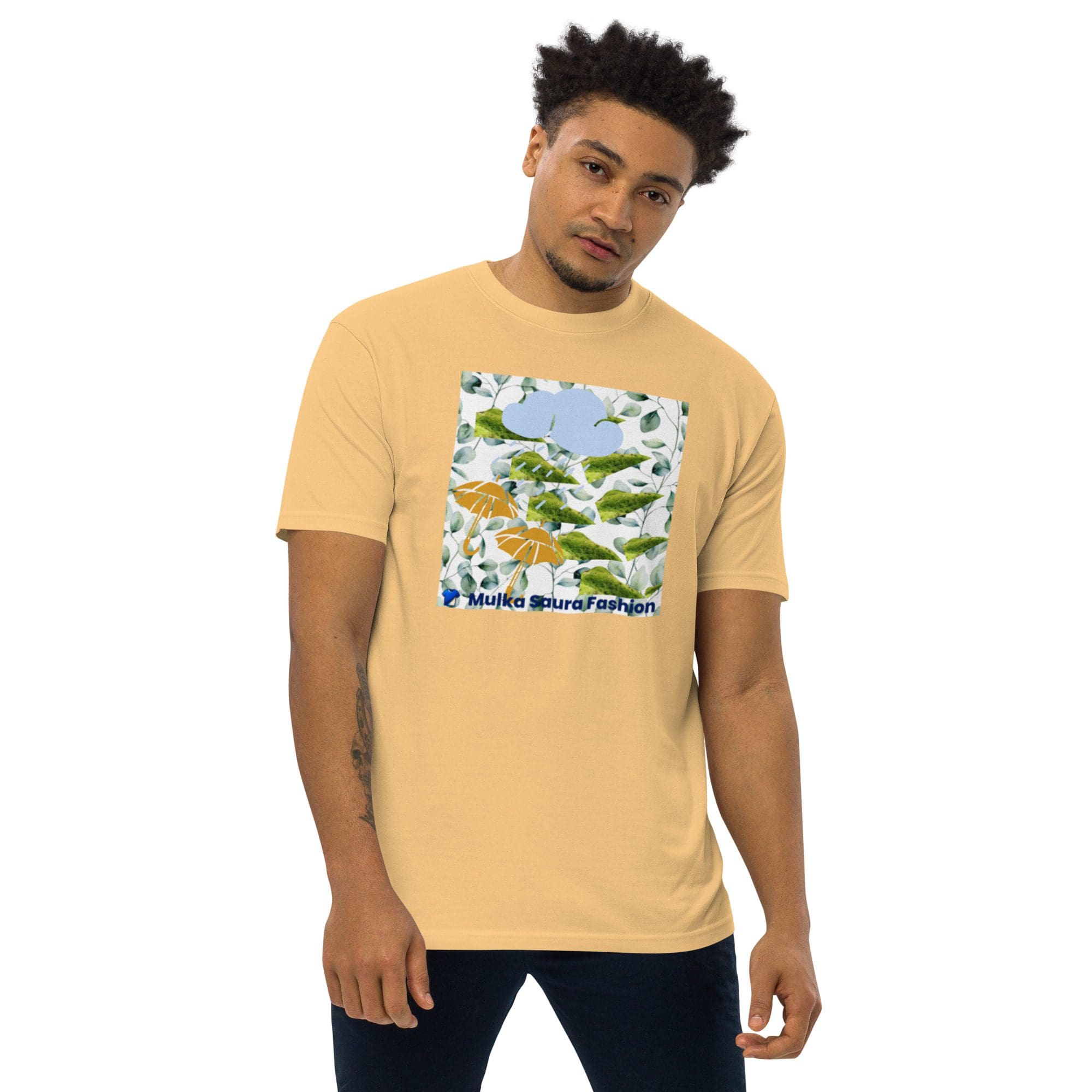 Man wearing yellow graphic t-shirt, standing casually.