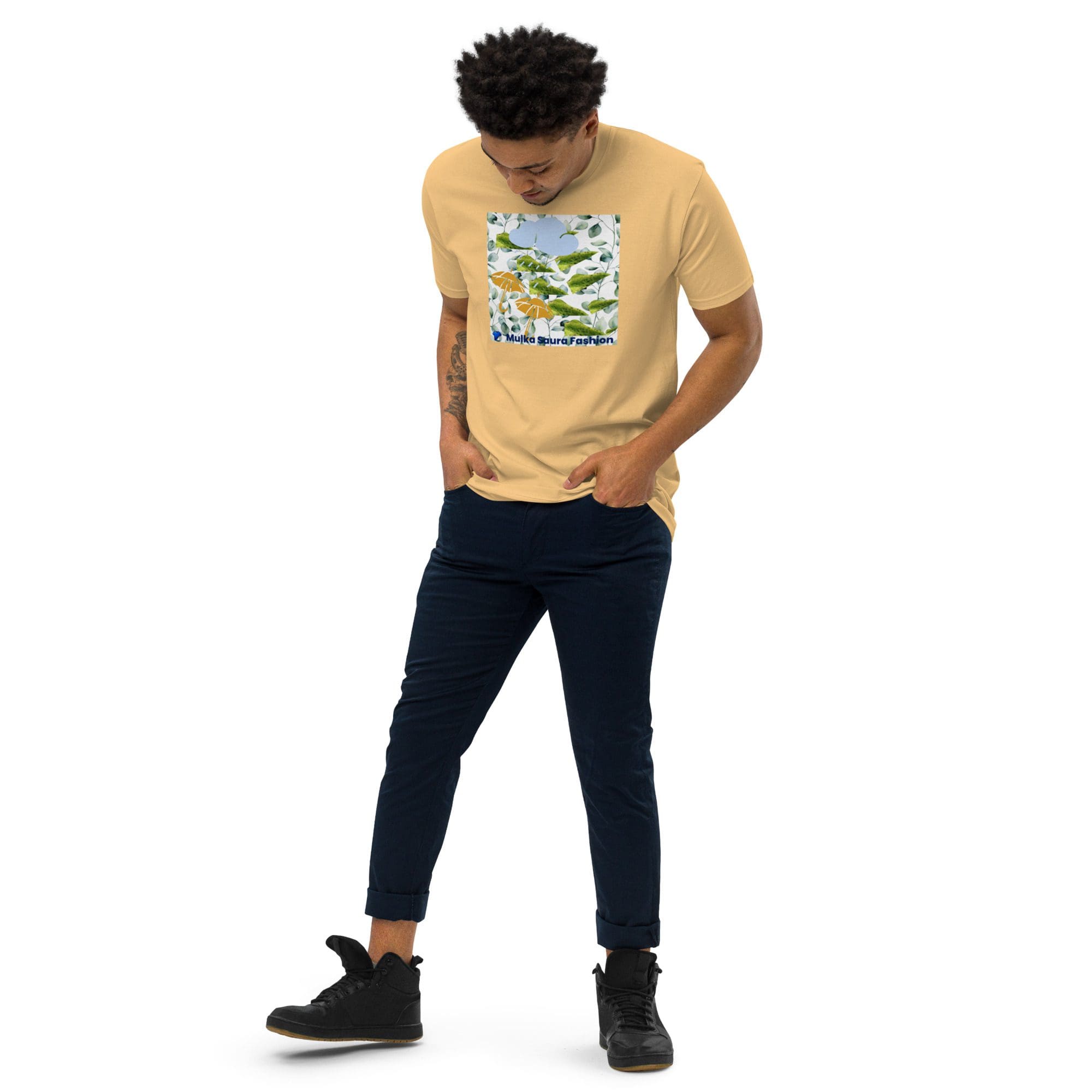 Man wearing yellow t-shirt with graphic design.