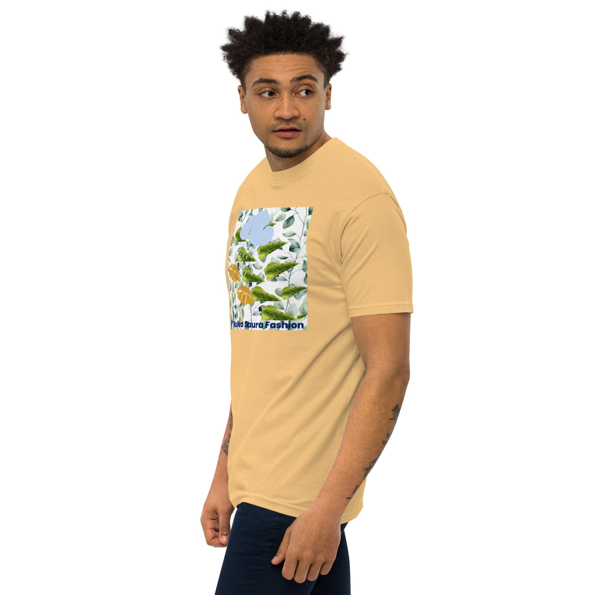 Man wearing beige t-shirt with graphic design.
