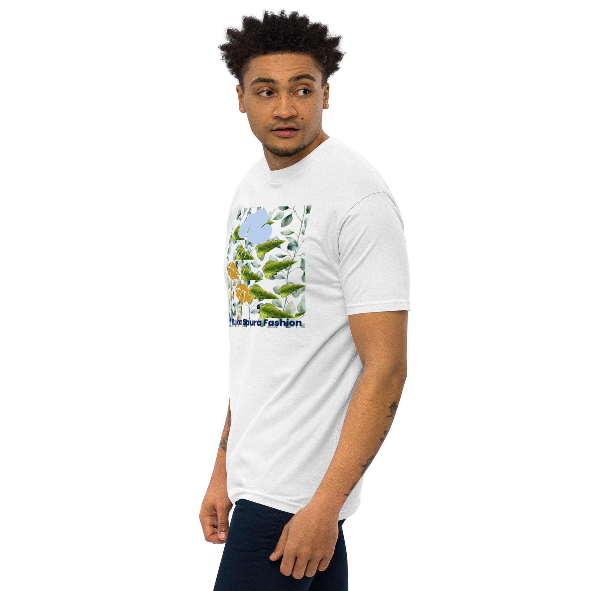 Man wearing white graphic t-shirt, looking sideways.