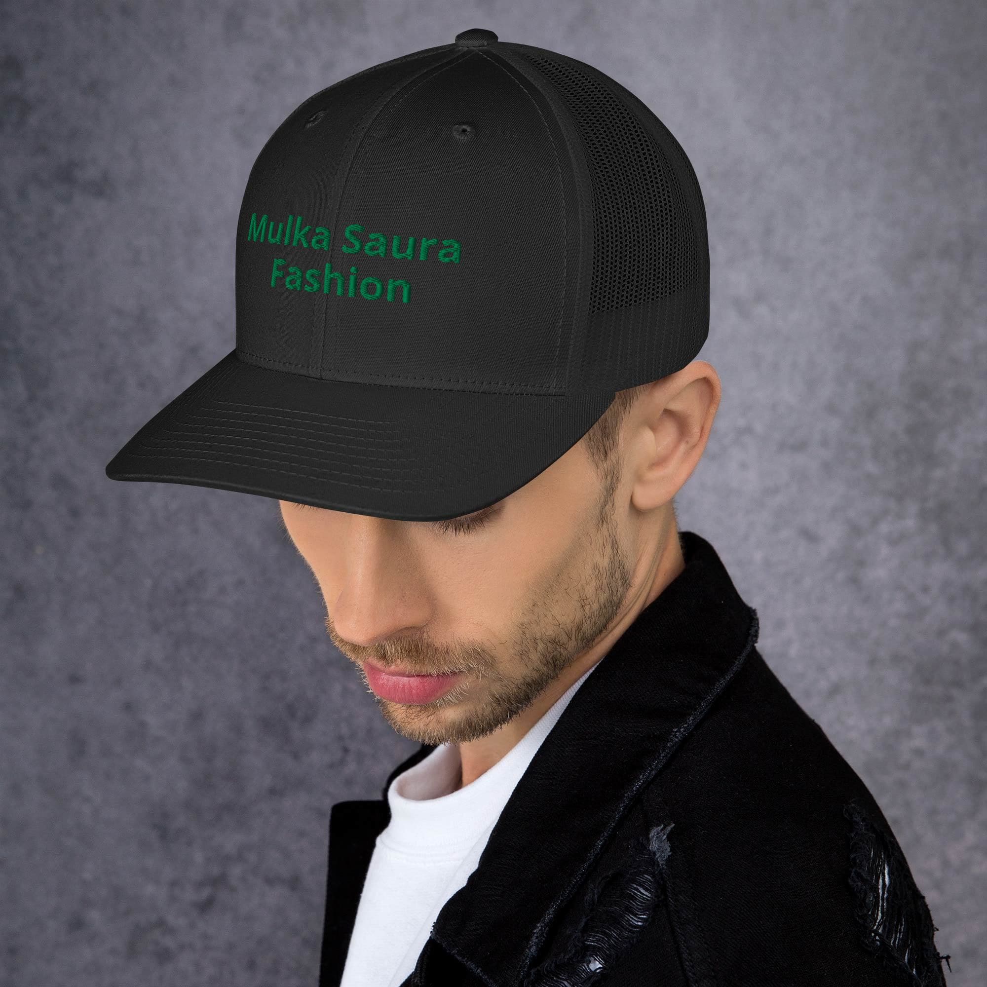 Man wearing black trucker cap with green logo