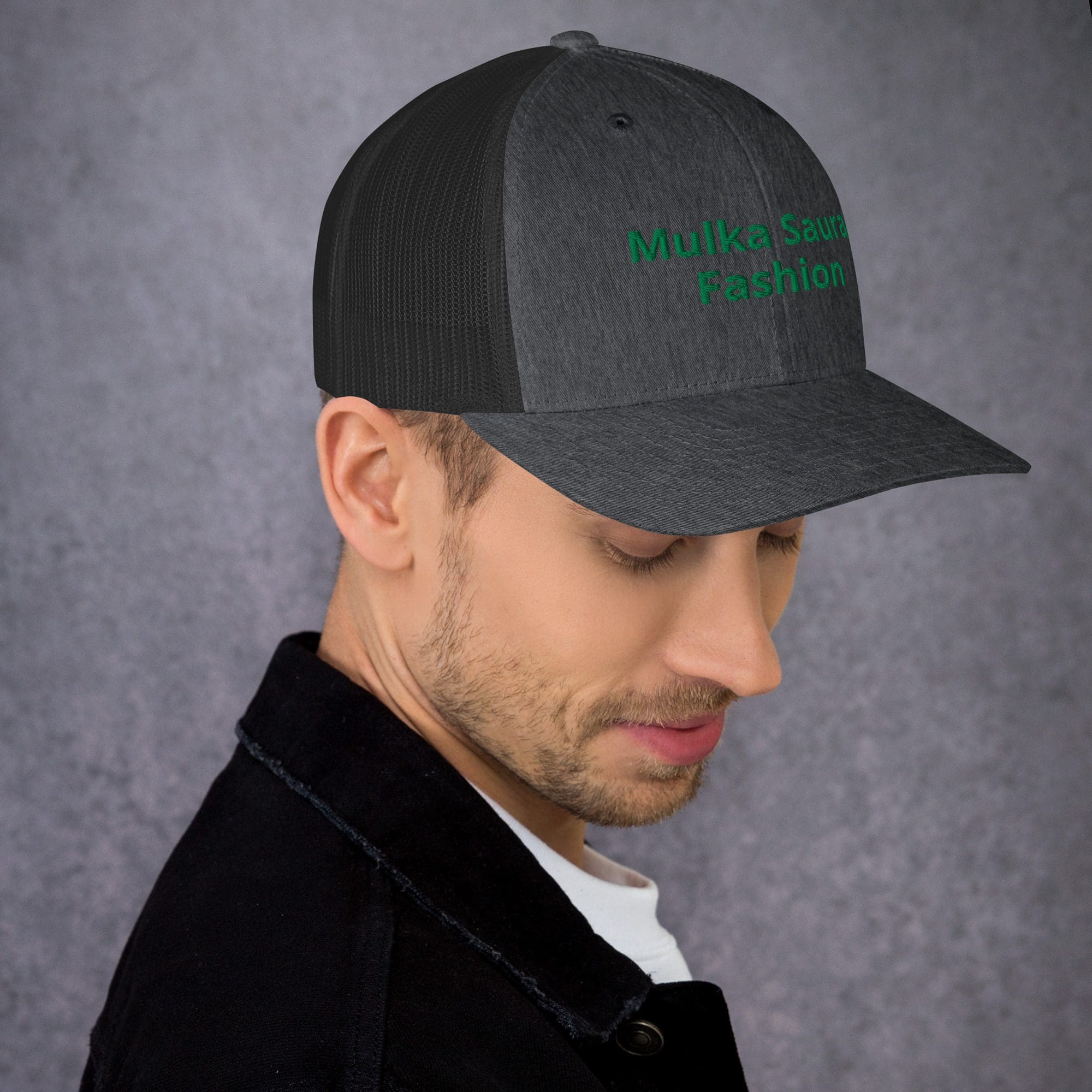 Man wearing gray "Mulka Sauce Fashion" cap.
