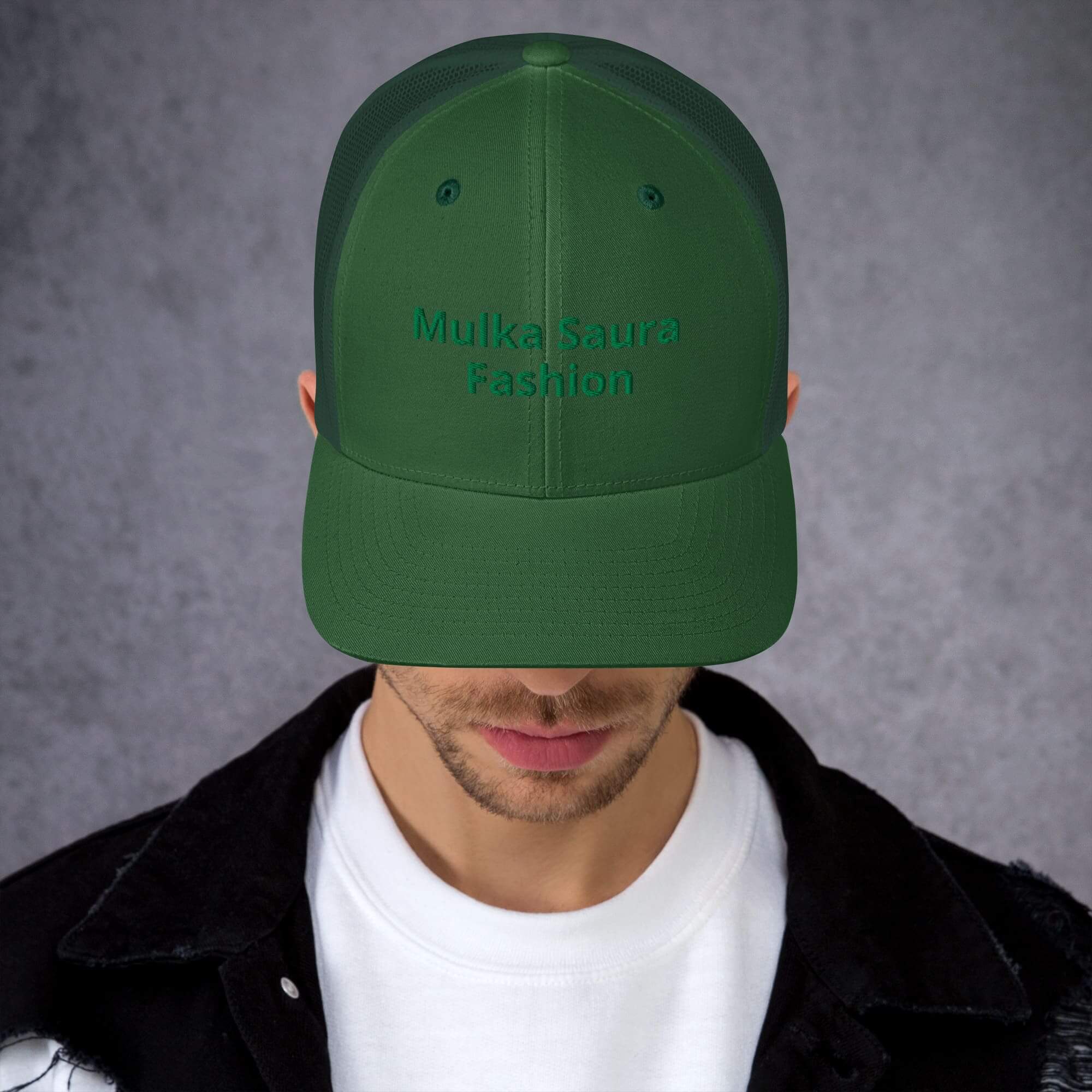 Man wearing green cap, facing down.