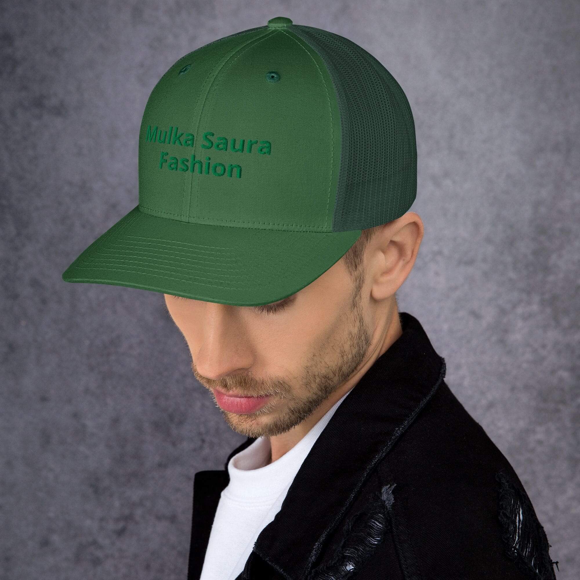 Man wearing green hat and black jacket.