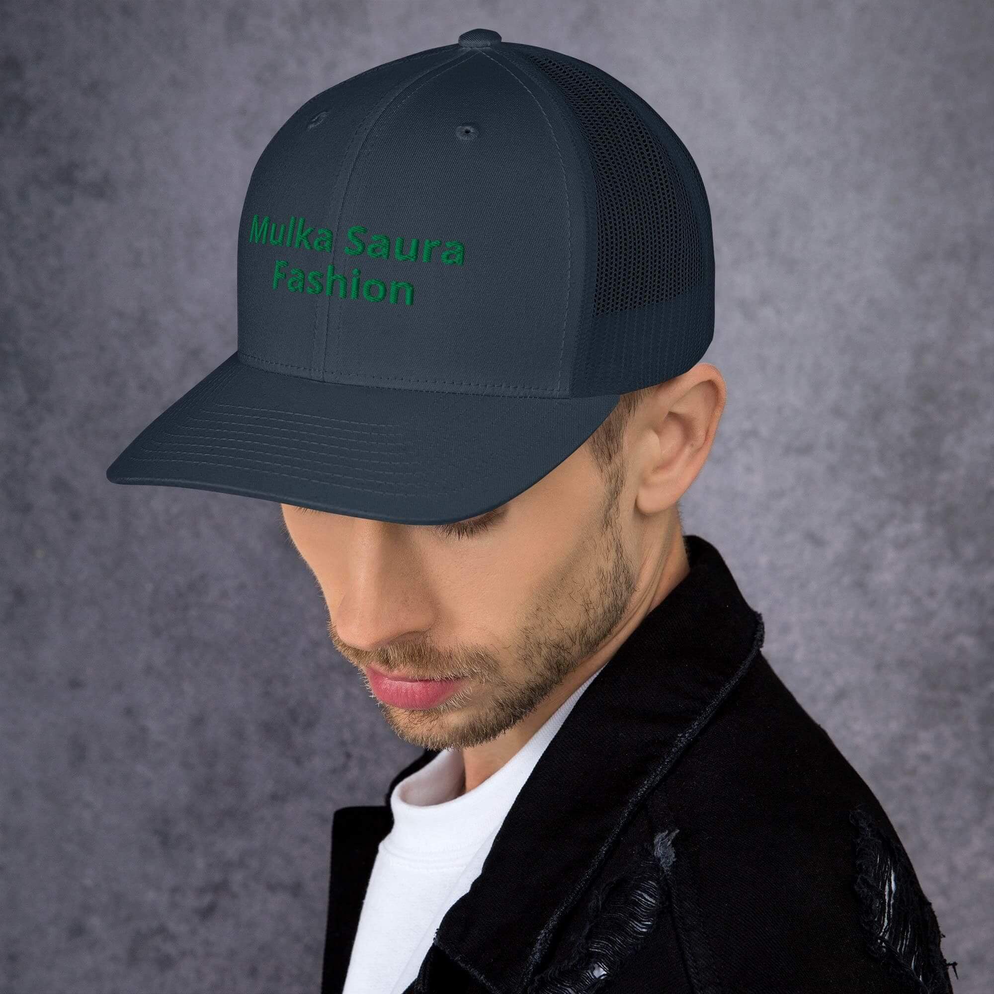 Man wearing dark cap and jacket.
