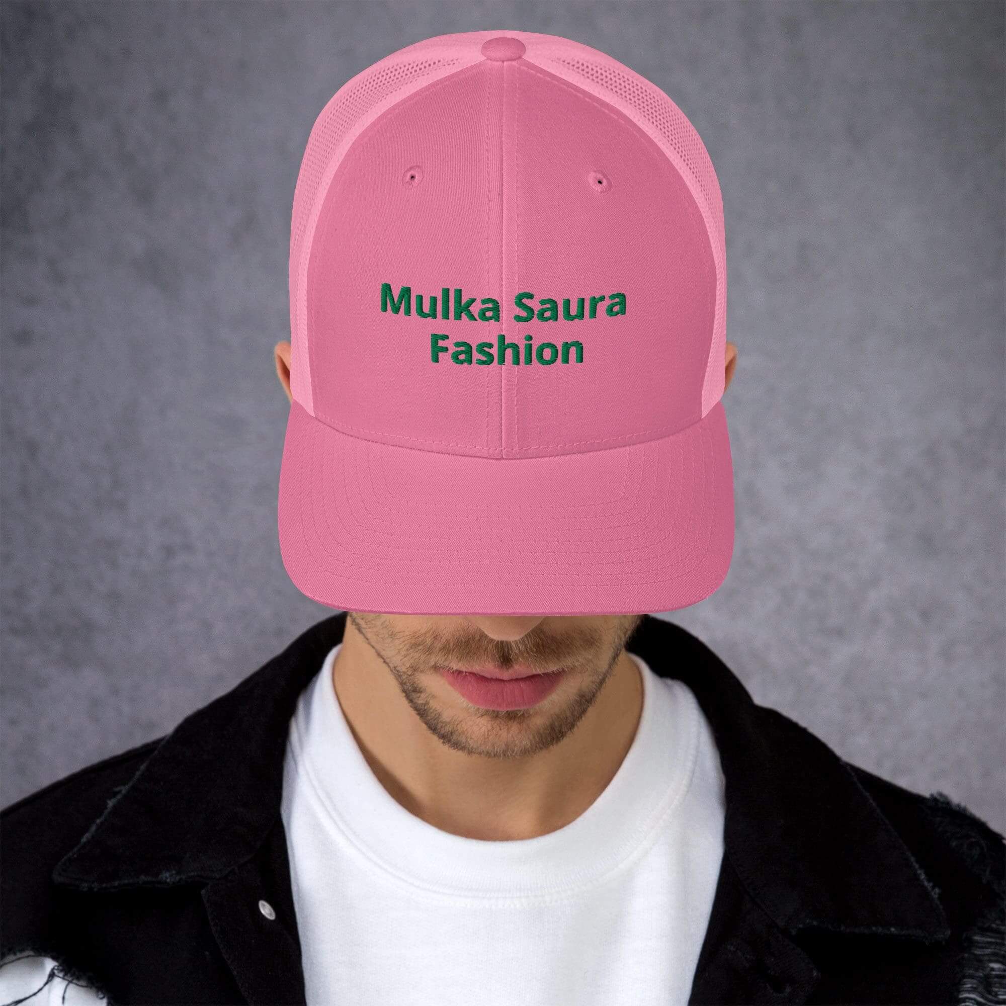 Man wearing pink "Mulka Saura Fashion" cap.