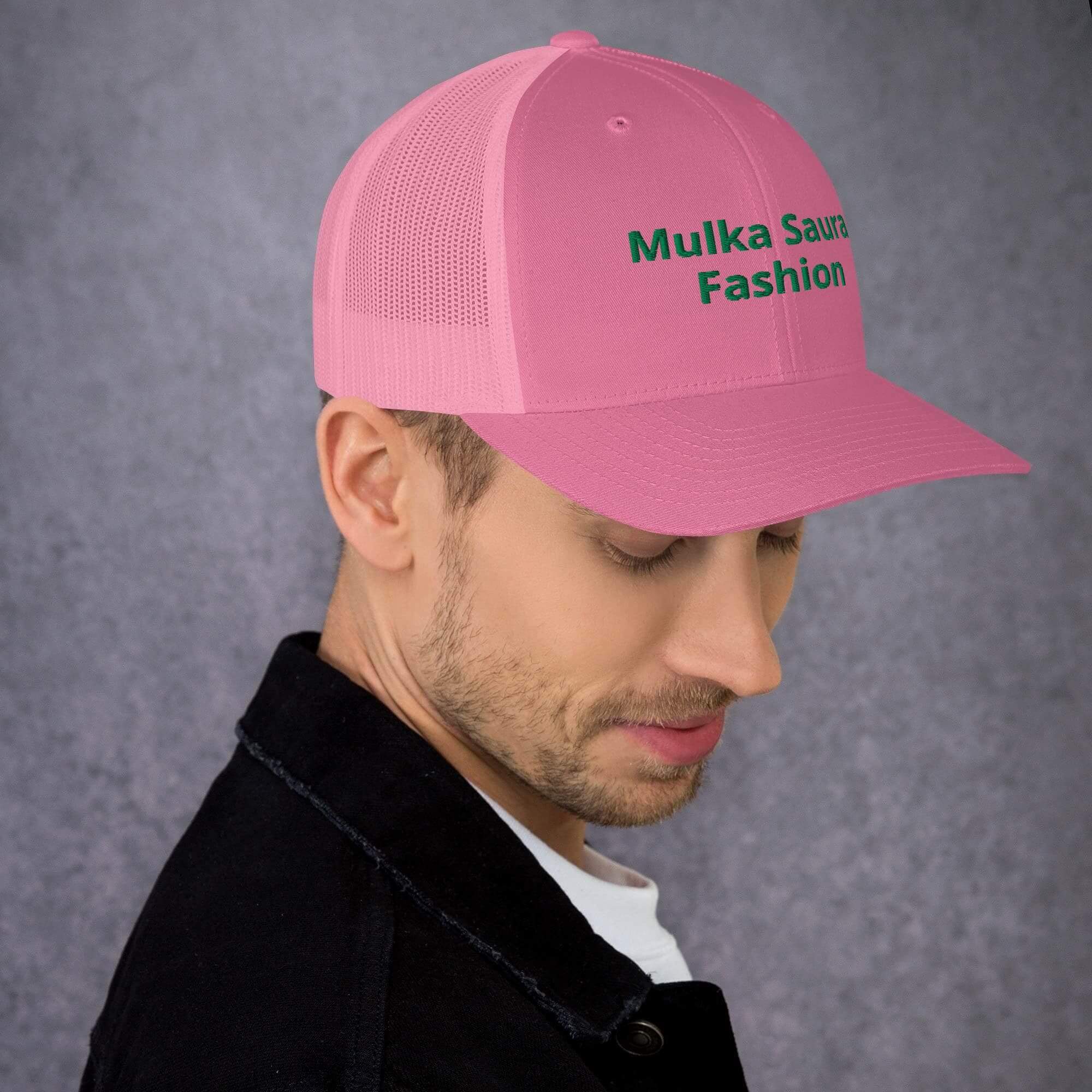 Man wearing pink mesh trucker cap
