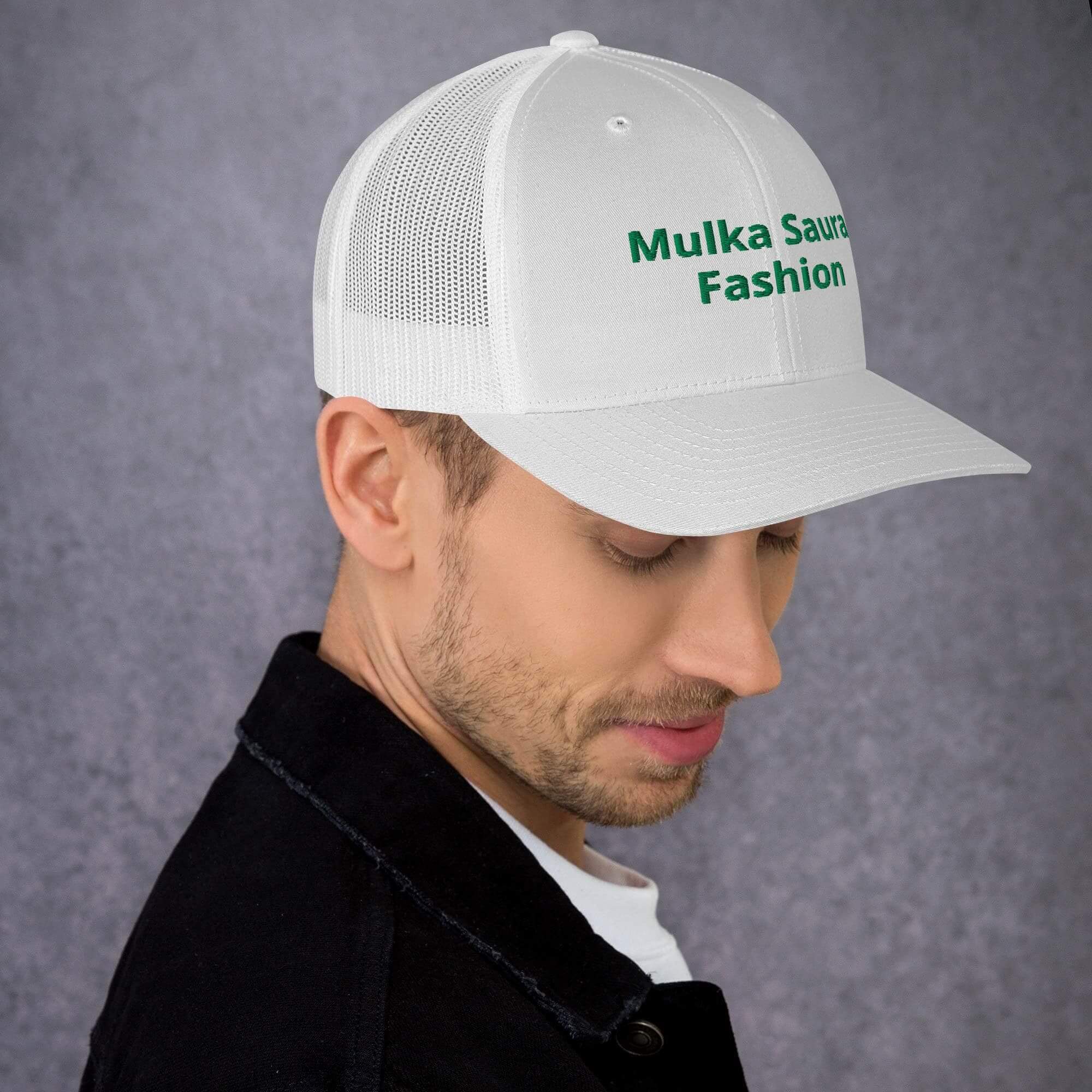 Man wearing white "Mulka Sauru Fashion" cap.
