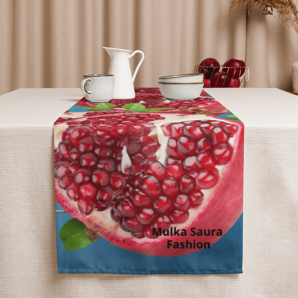 Table with pomegranate-themed table runner.