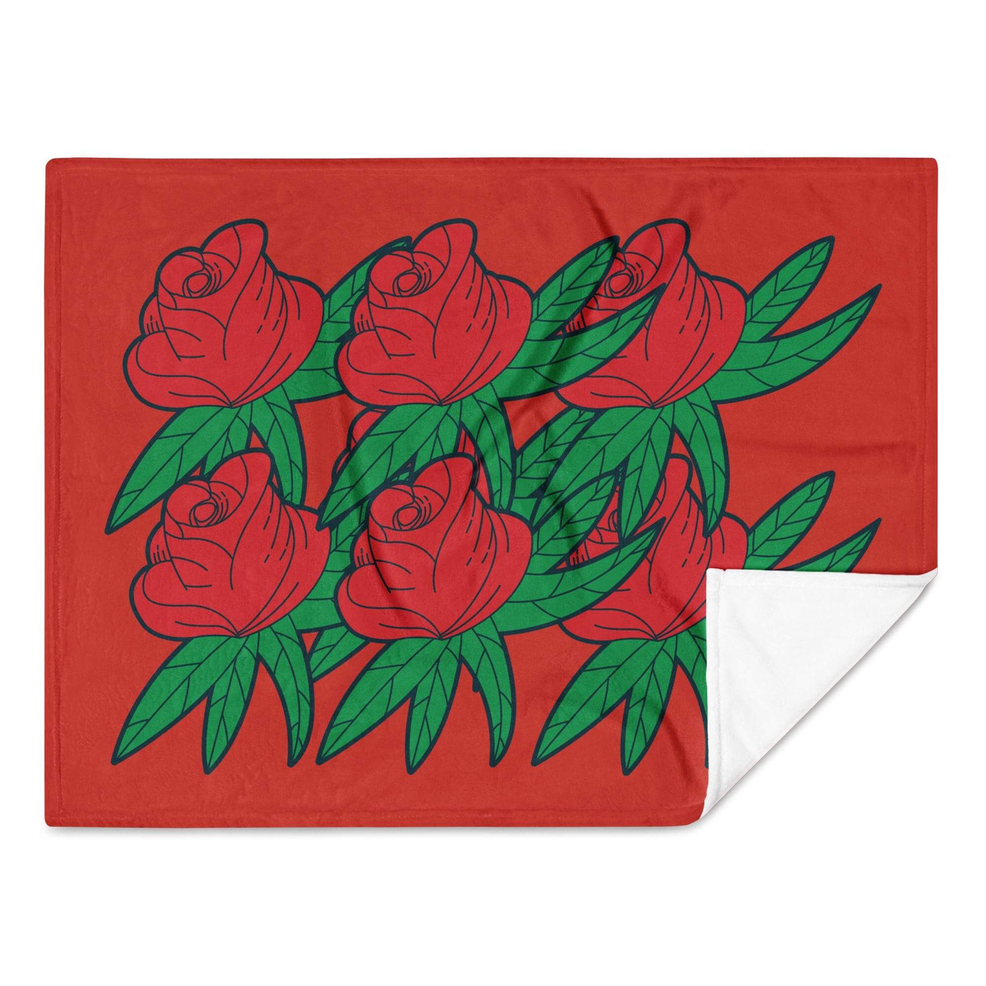 Red roses with green leaves on blanket.