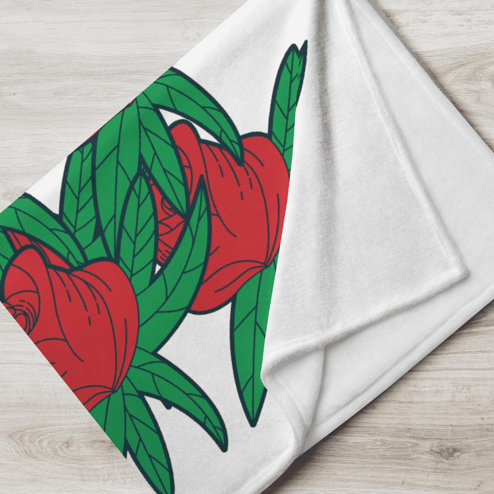 Red roses and green leaves on blanket.