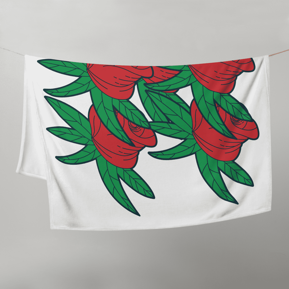 Red roses and green leaves on cloth.