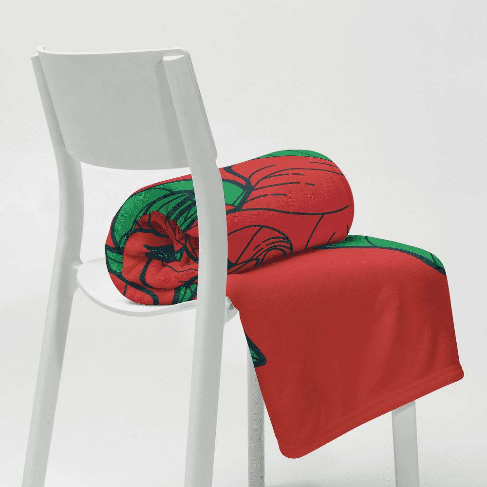 Red and green blanket on white chair.