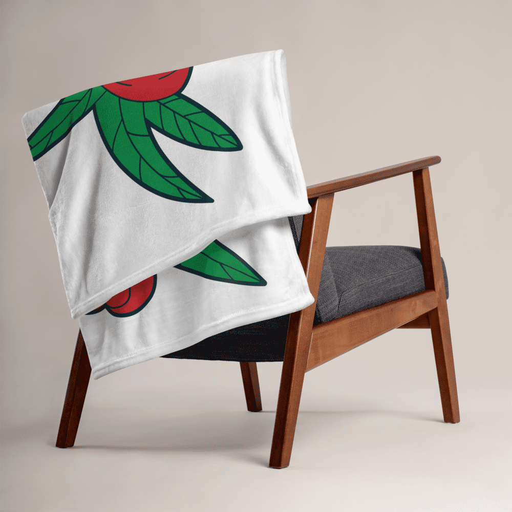 Chair with a colorful patterned blanket.
