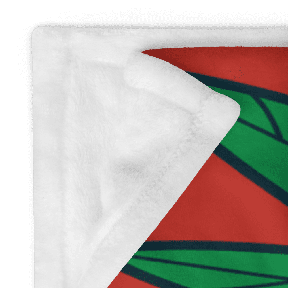 White fleece blanket with colorful geometric design.