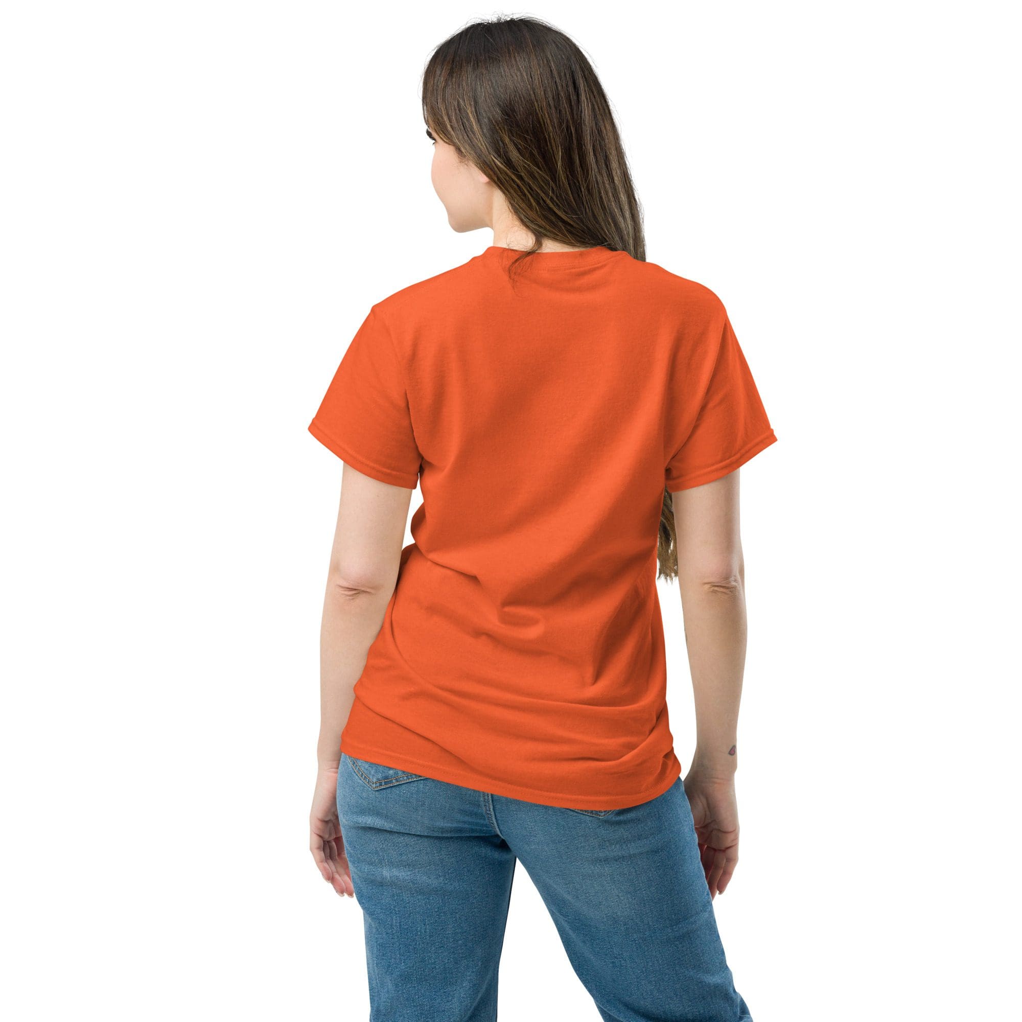 Woman in orange shirt, blue jeans, back view.