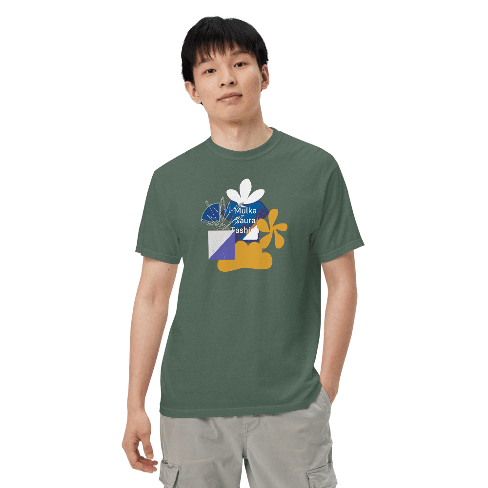 Man wearing green graphic t-shirt, dark background.