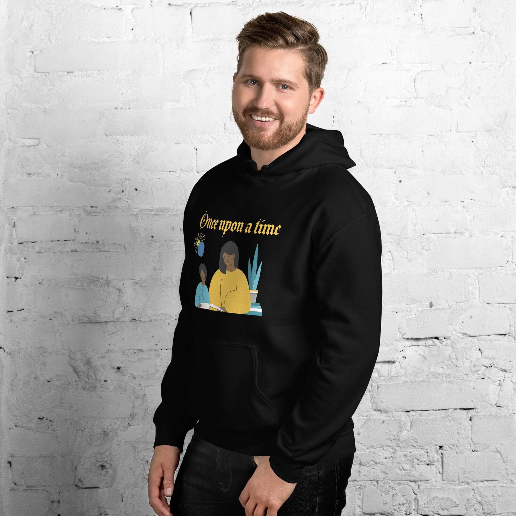 Man in black hoodie with graphic design.