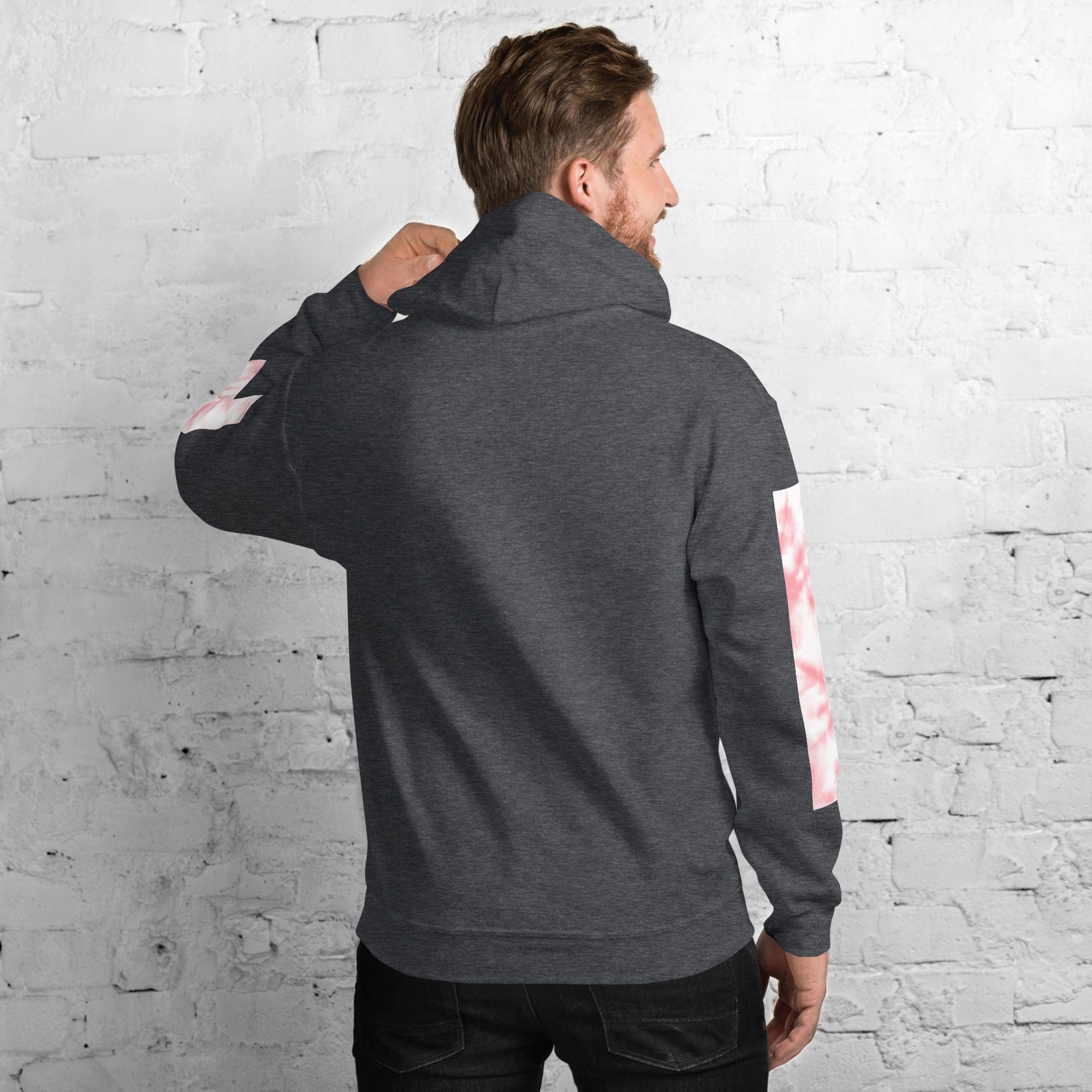 Man wearing a dark hoodie, white background.