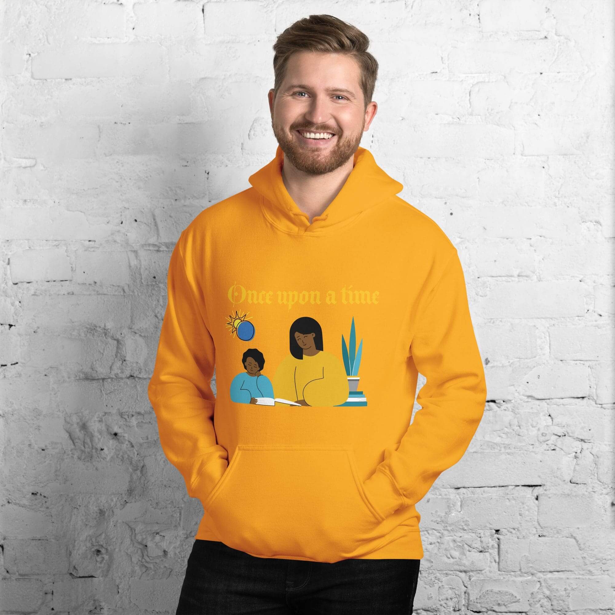 Man wearing yellow hoodie with illustrated design.