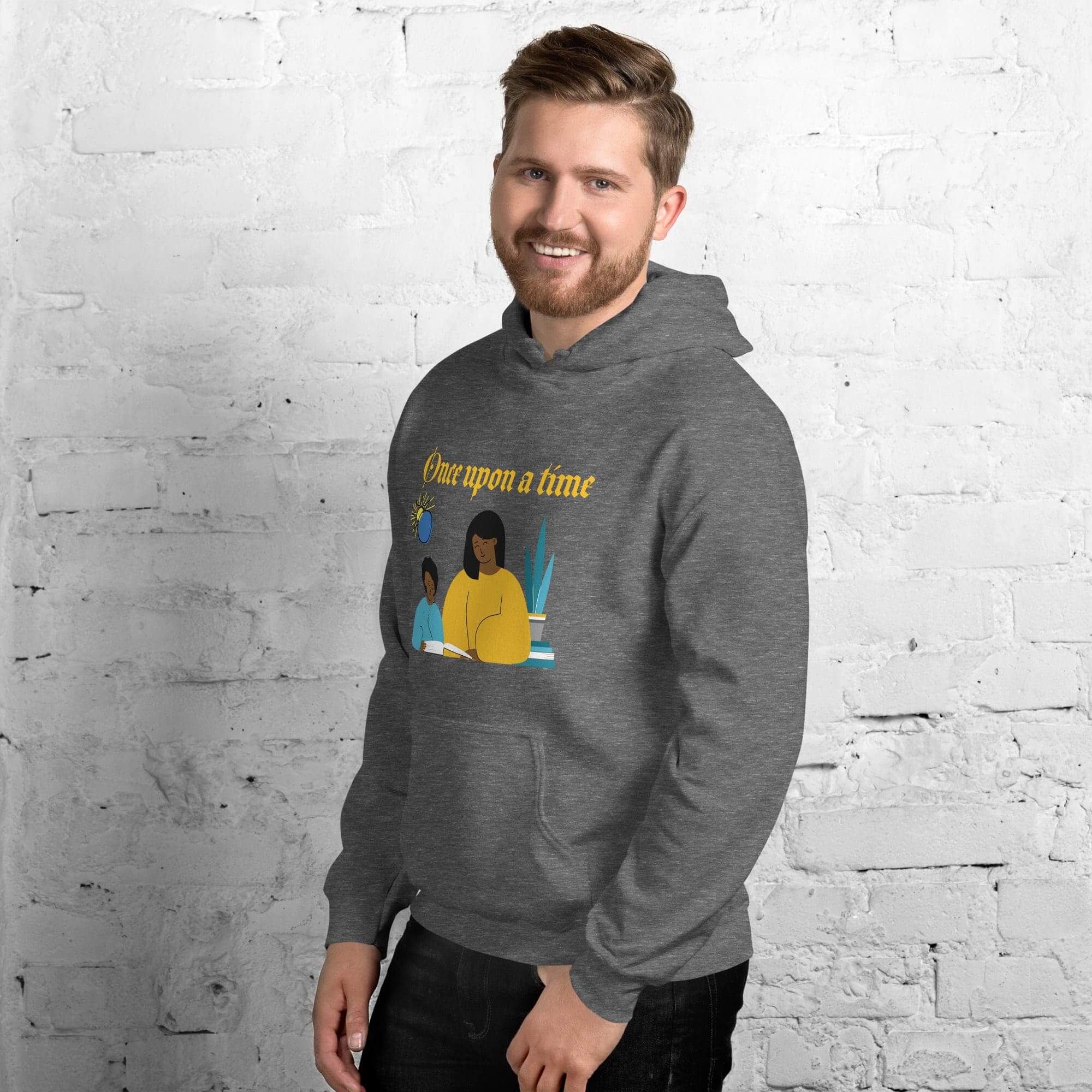 Man wearing a gray hoodie, smiling.
