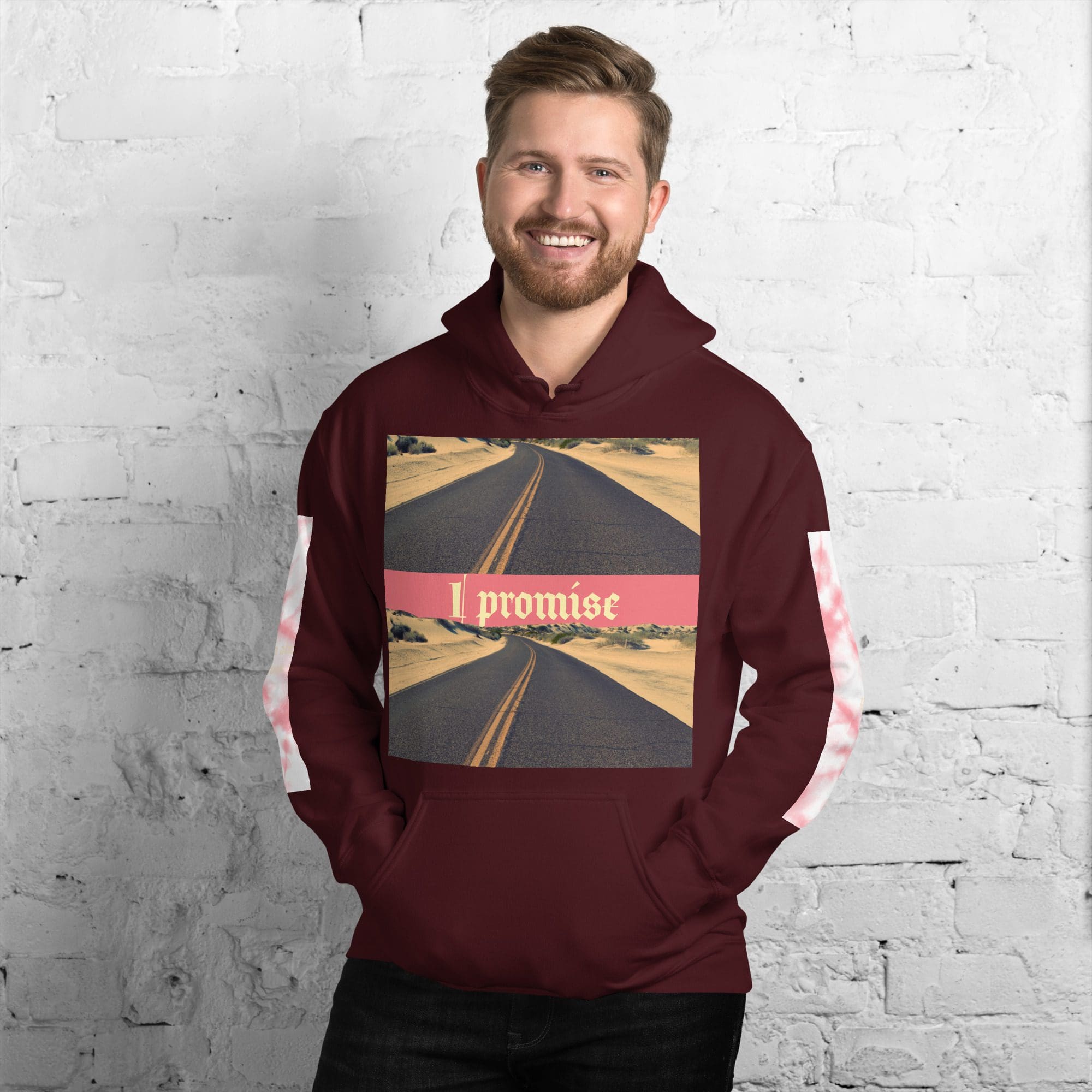 Smiling man in maroon "I promise" hoodie