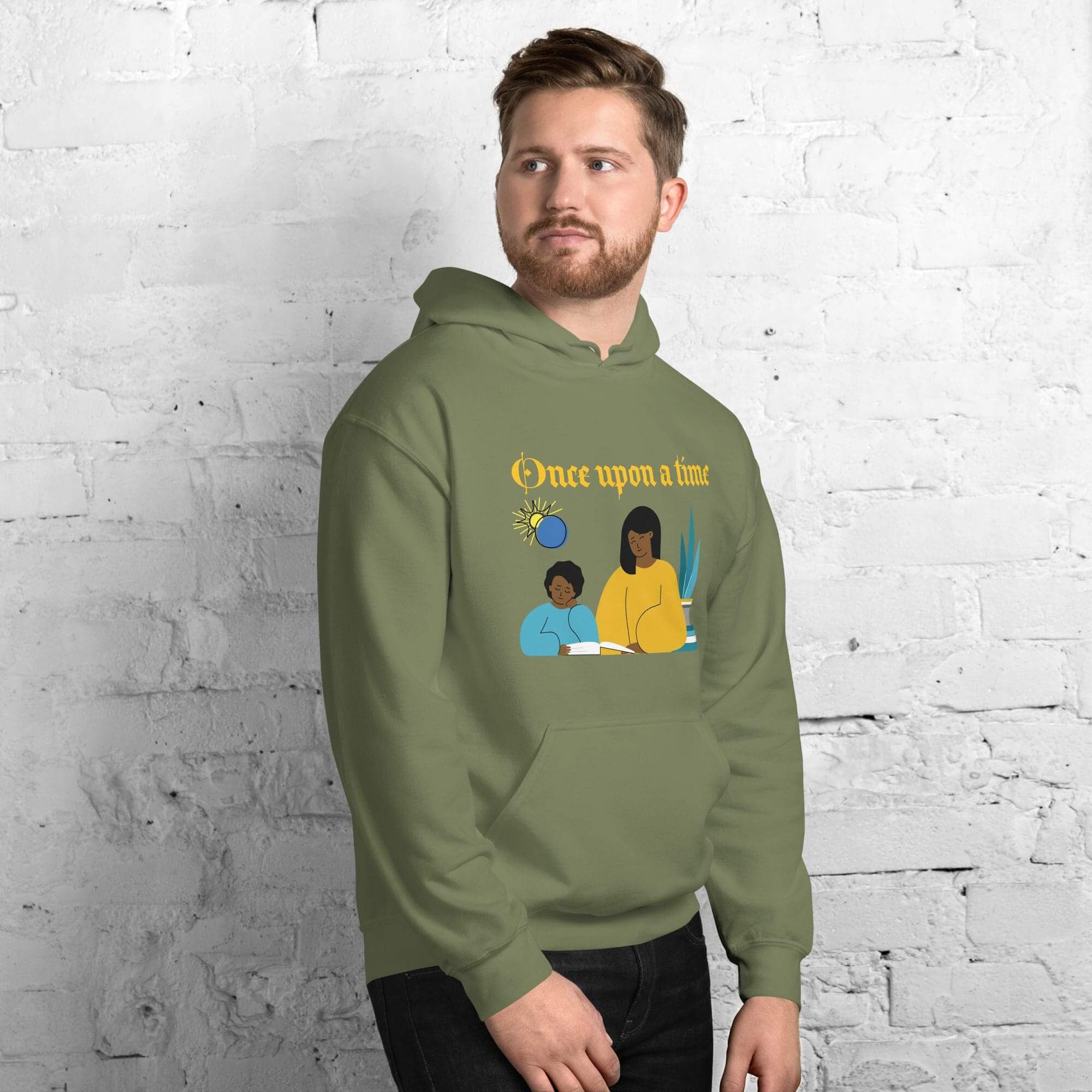 Man in olive hoodie with storybook illustration