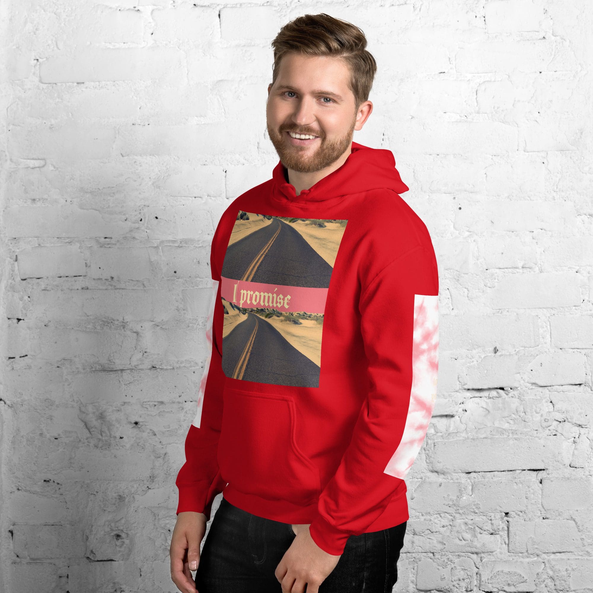 Smiling man wearing red hoodie with road print