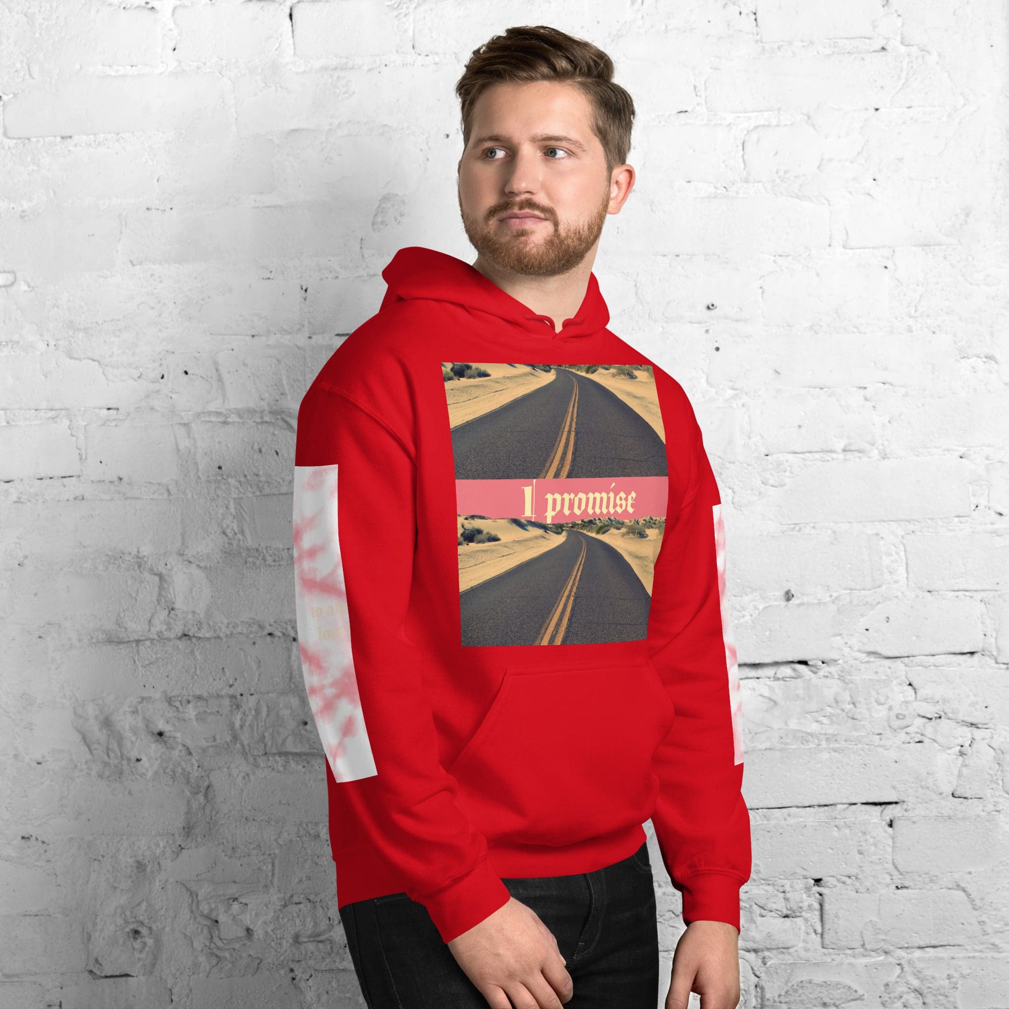 Man wearing red hoodie against brick wall.