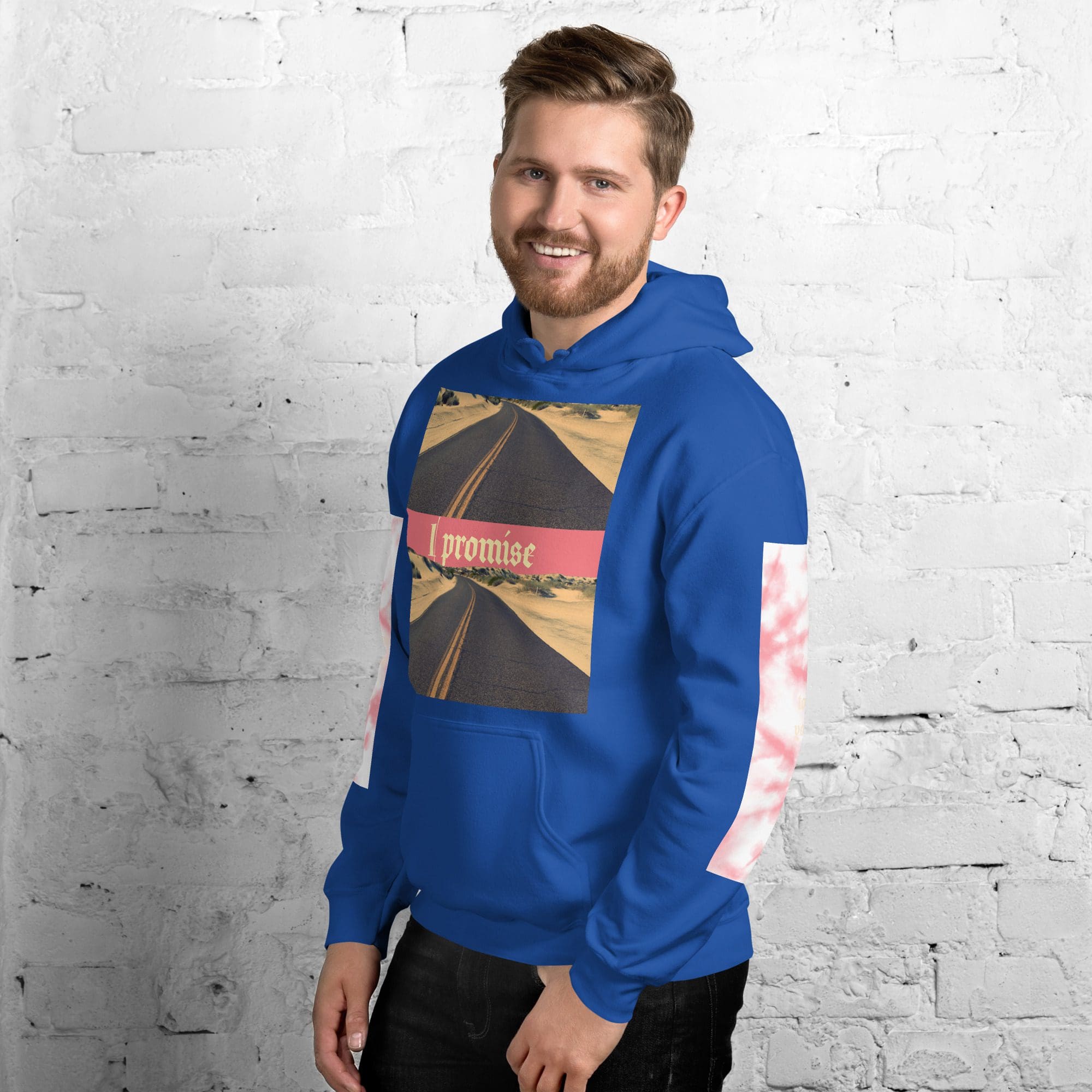 Smiling bearded man in blue "I promise" hoodie