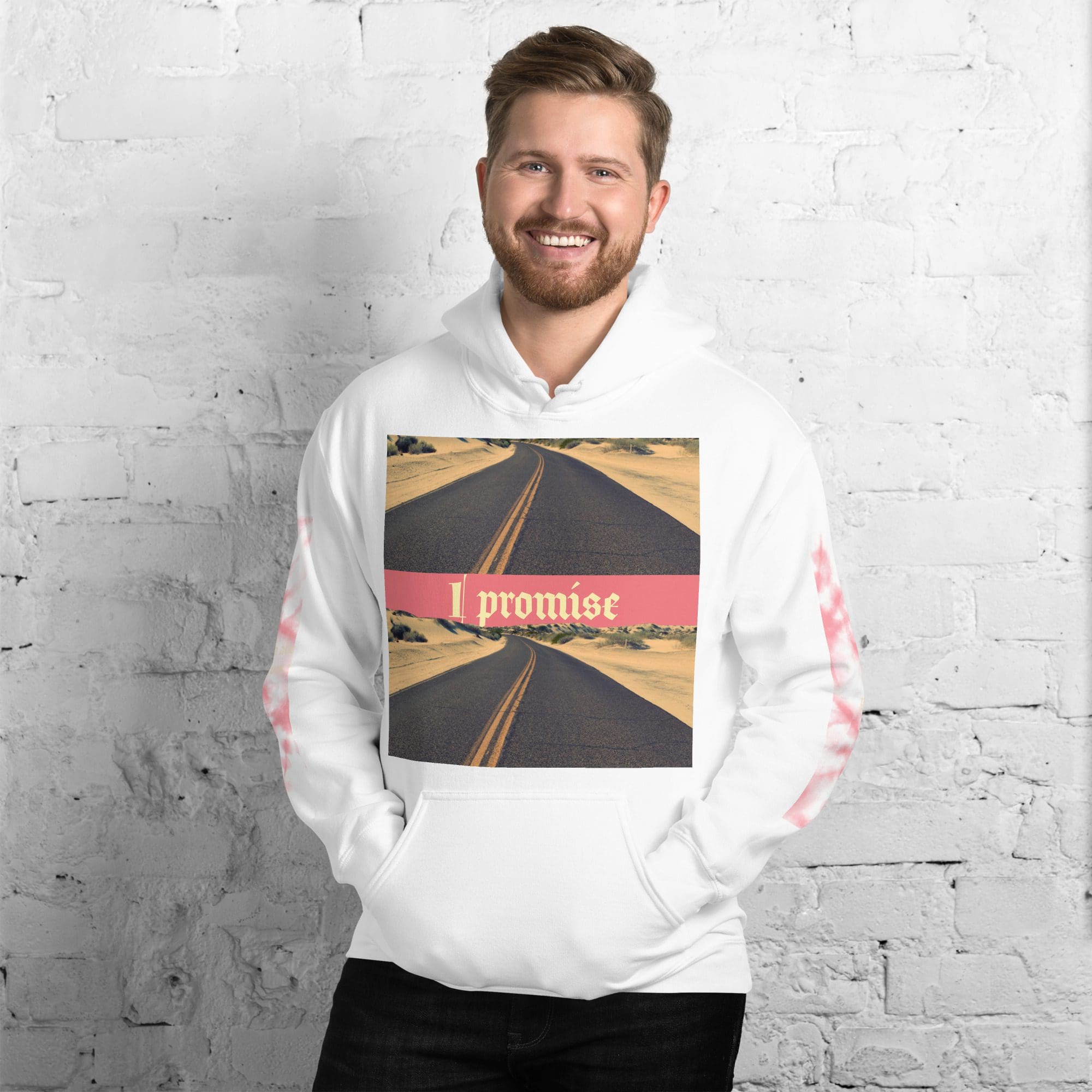 Smiling man wearing white "I promise" hoodie