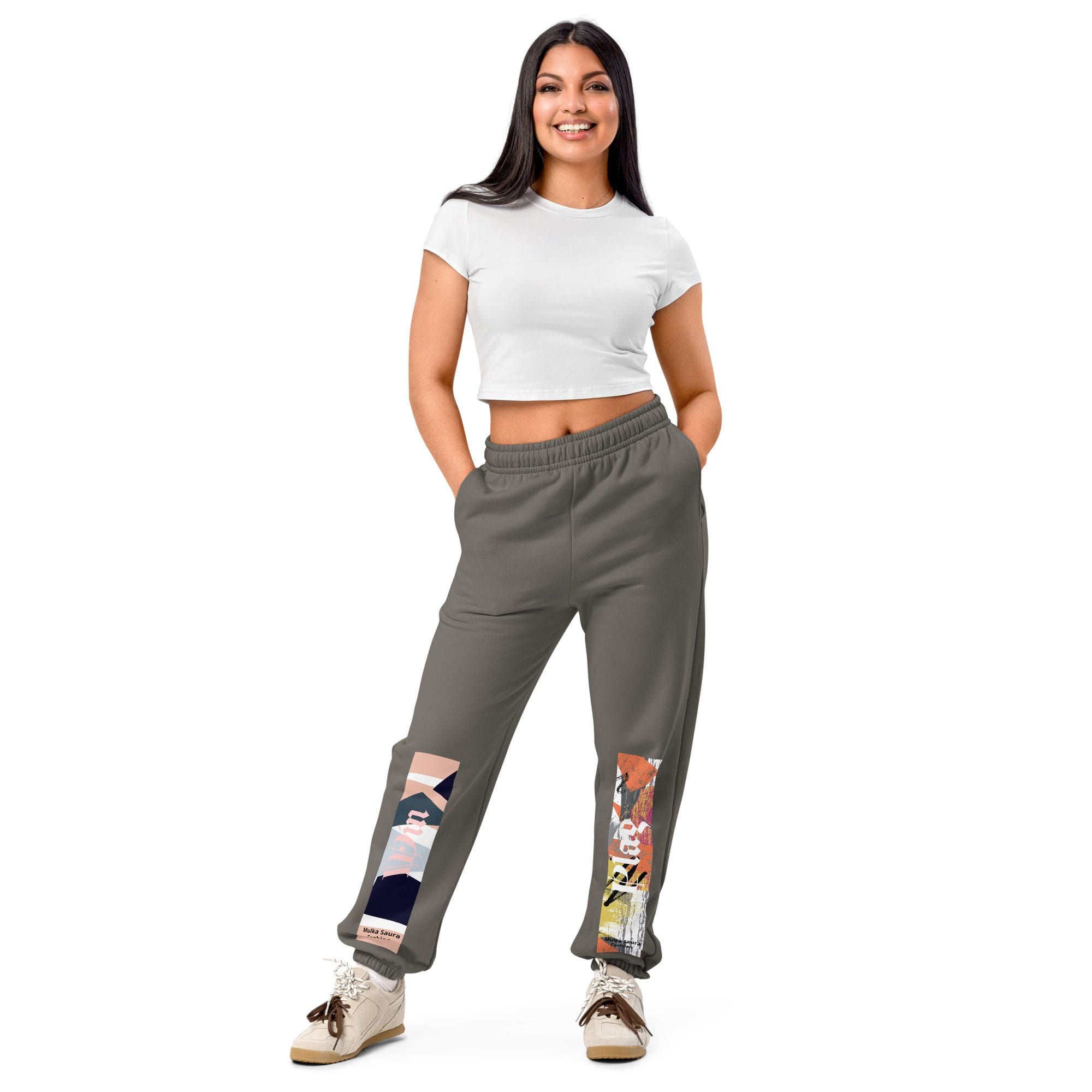Woman in white top and graphic pants.