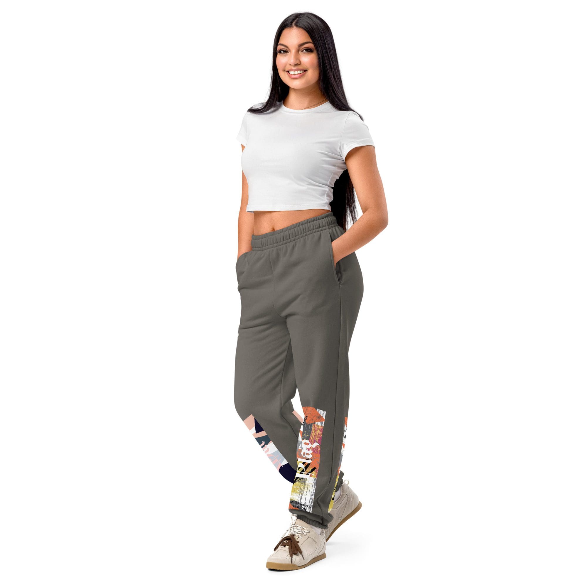 Woman wearing casual outfit, smiling confidently.