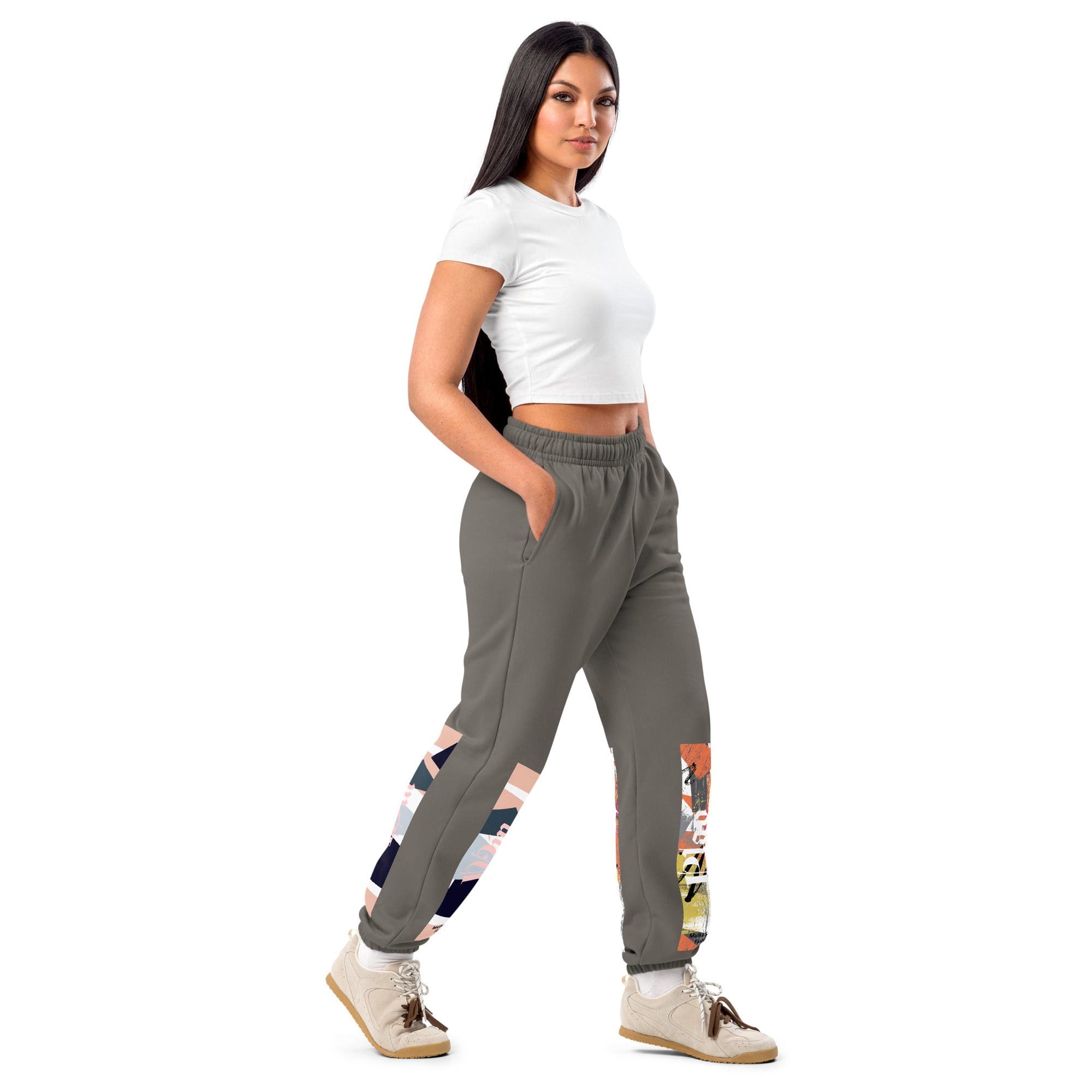 Woman wearing stylish joggers and white top.