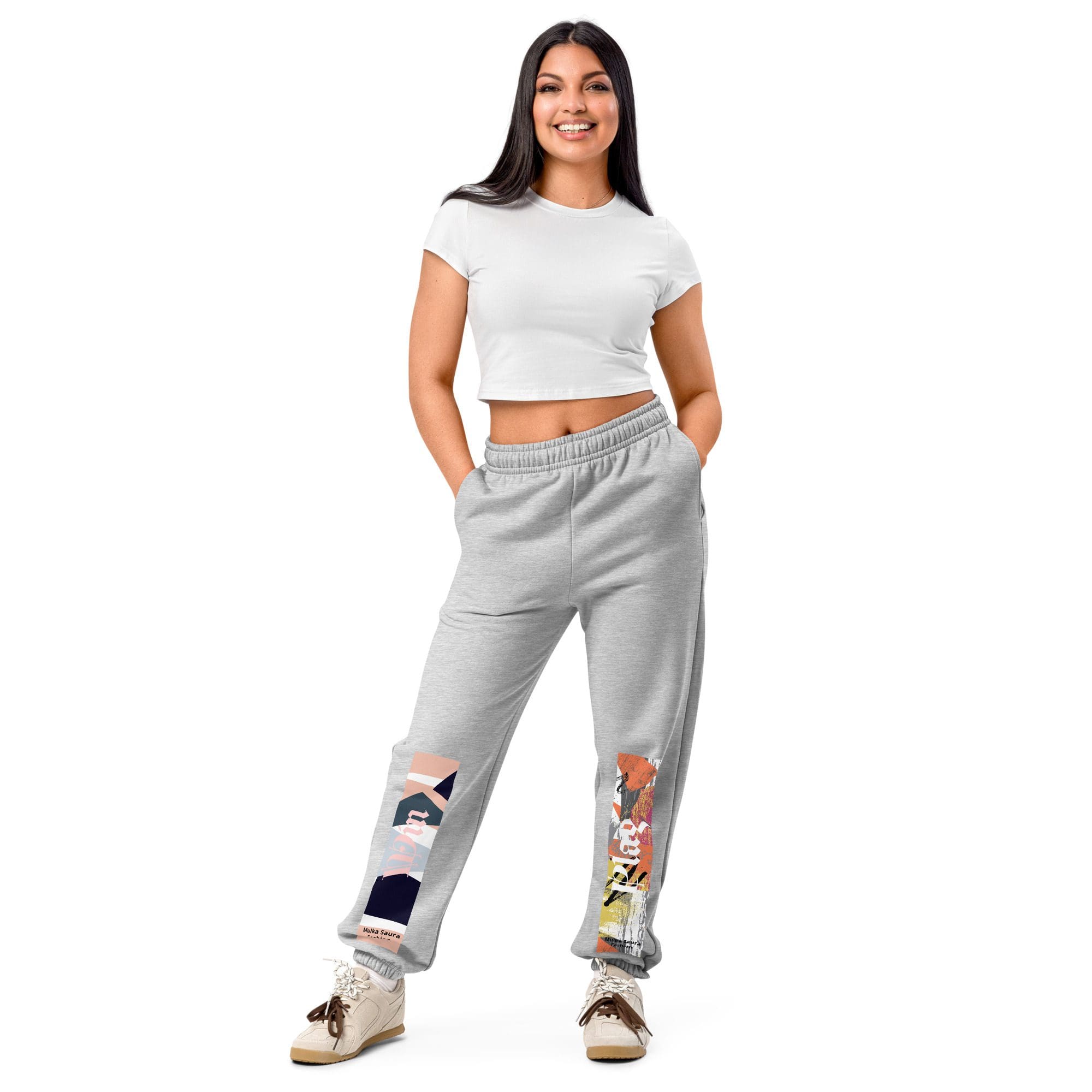 Woman in white top and gray sweatpants.