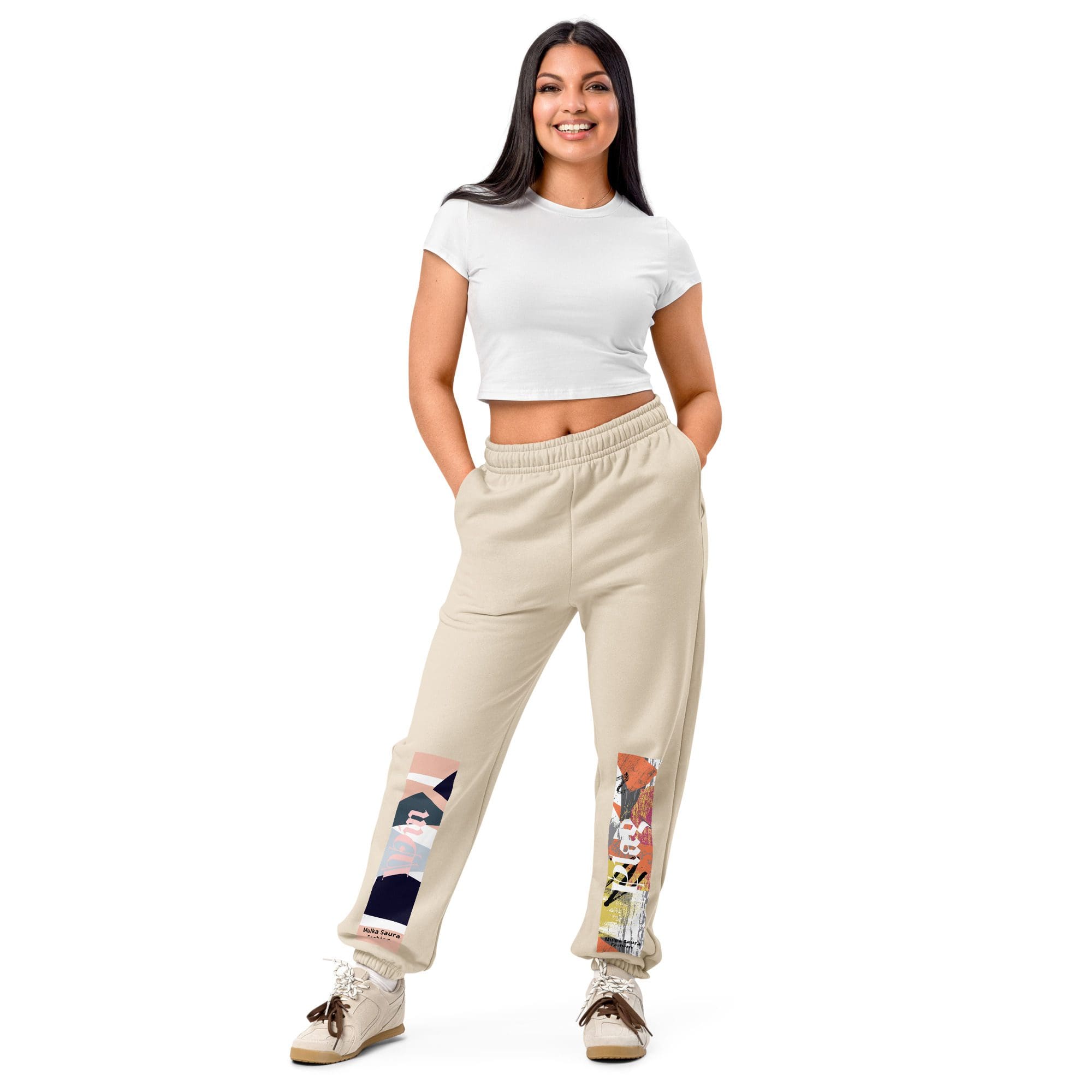 Woman wearing white top and beige pants.