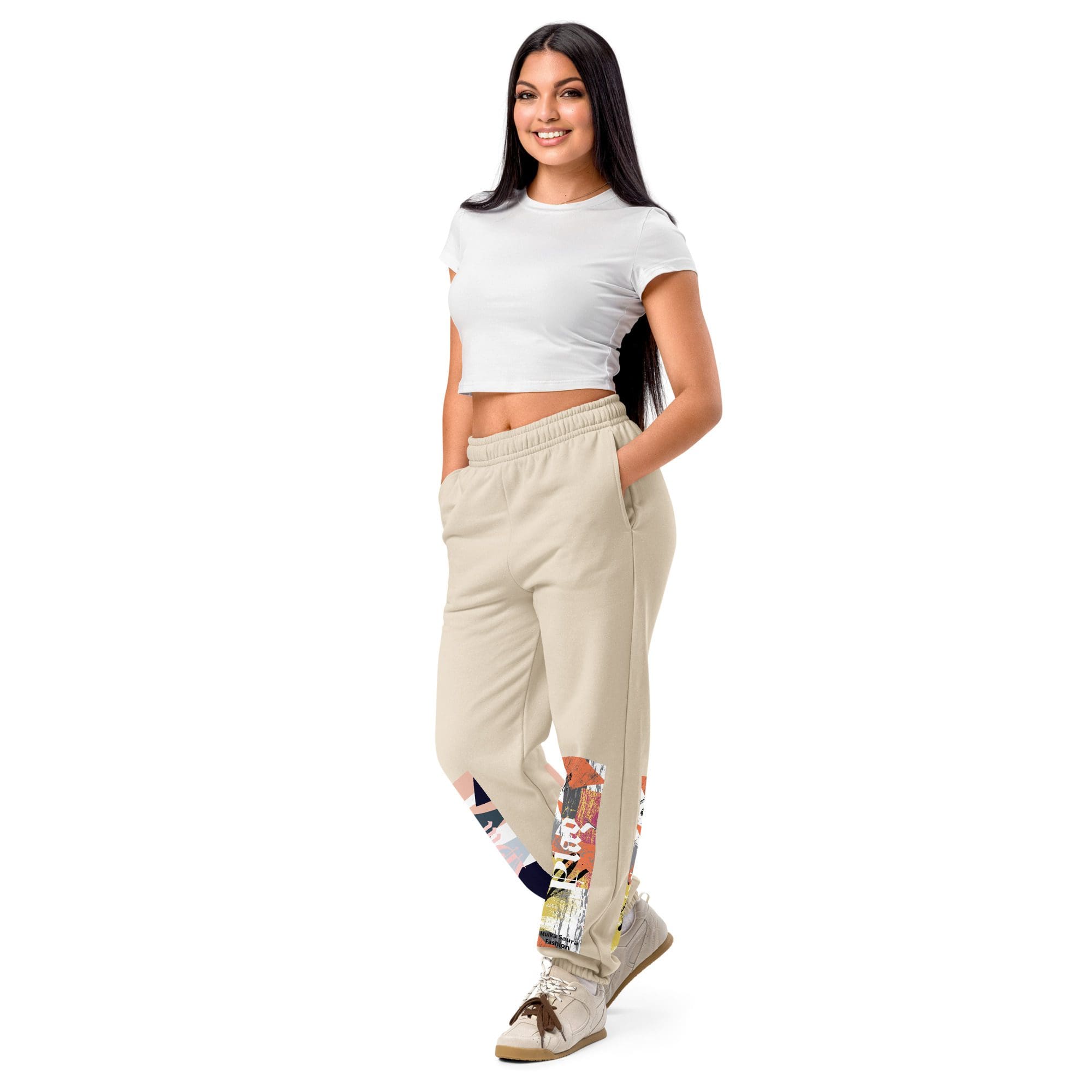 Woman in white top and beige pants.