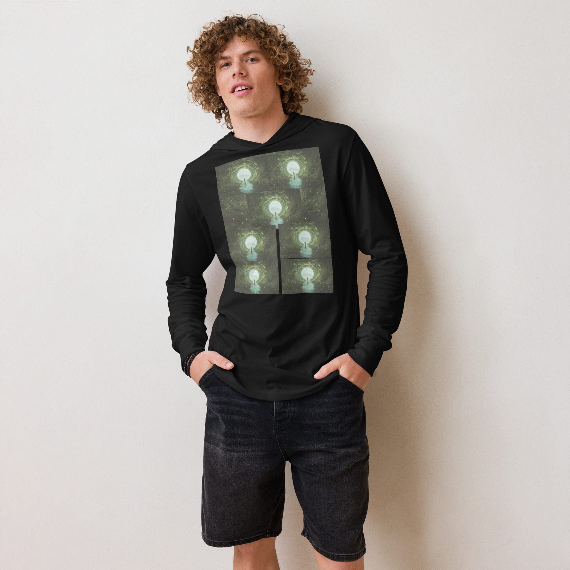 Man wearing black hoodie with lightbulb design.