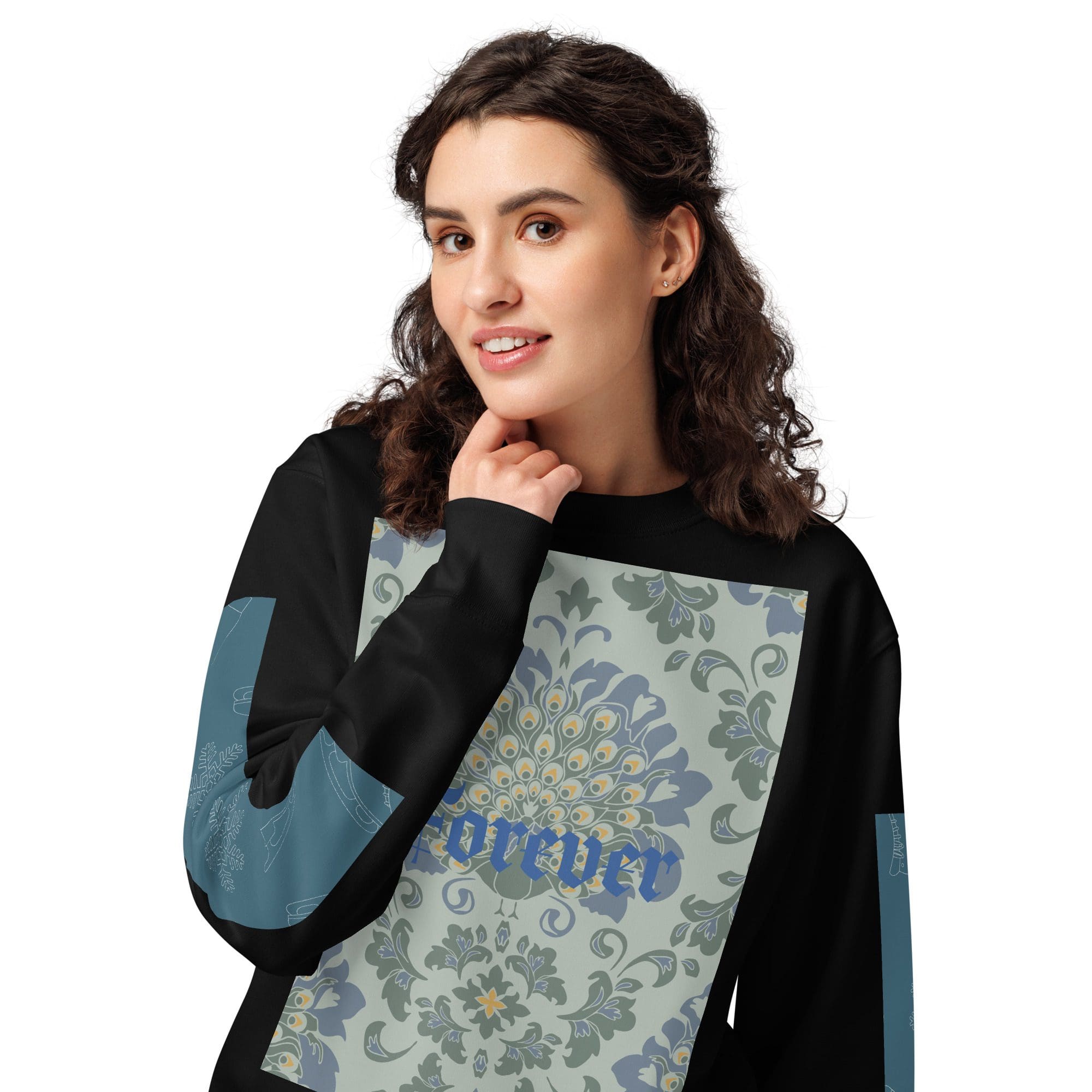 Smiling woman wearing a patterned black shirt.