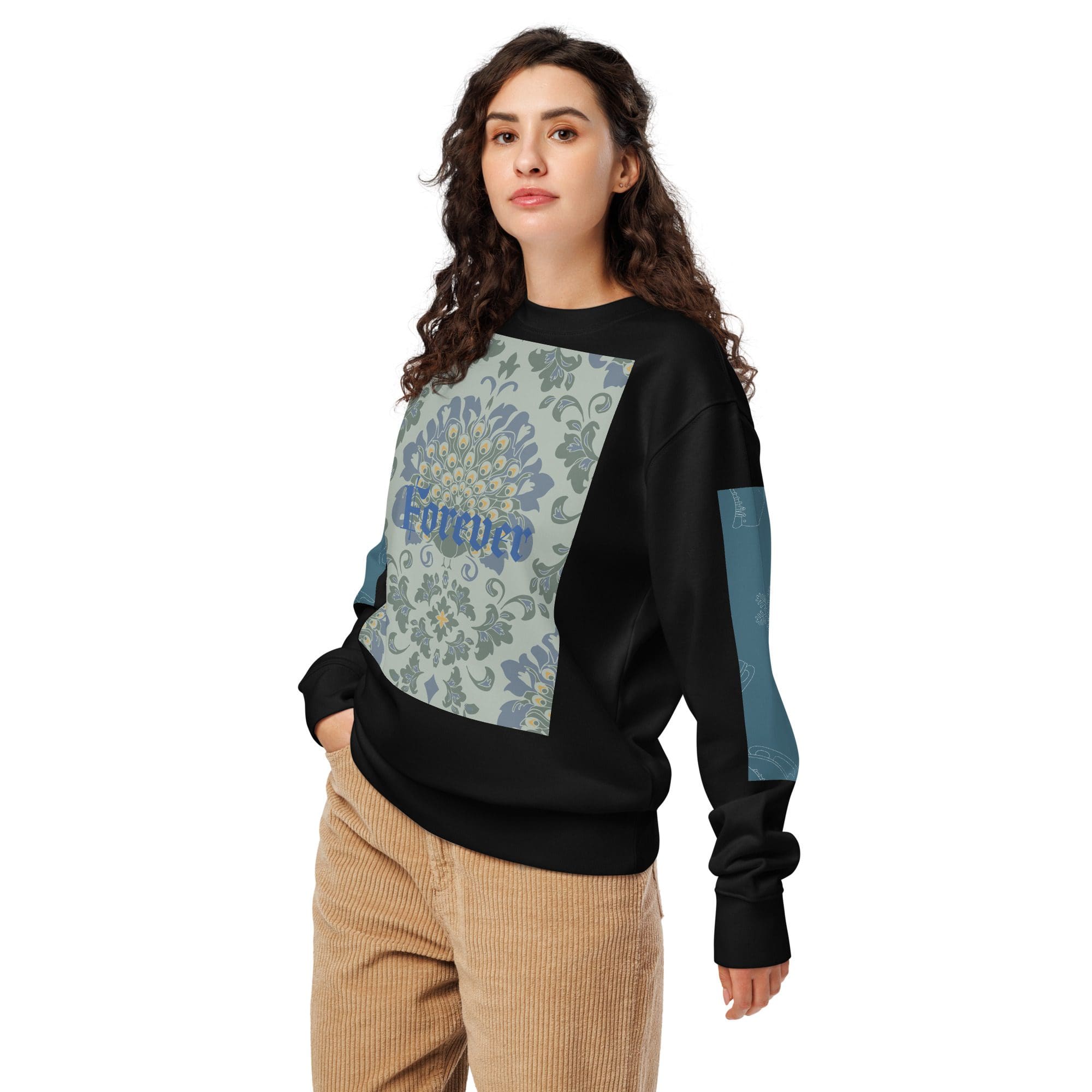 Woman in patterned sweater and corduroy pants.