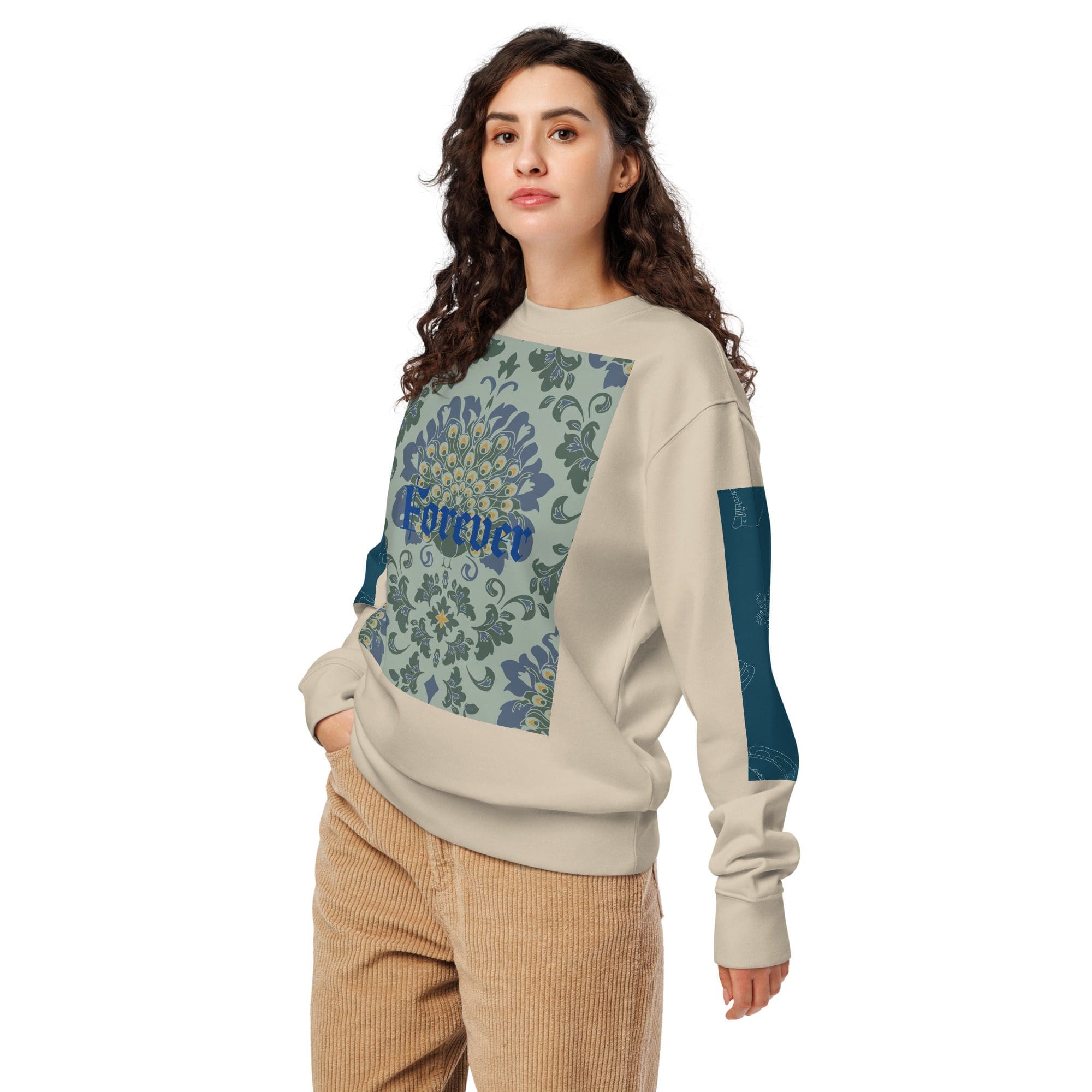 Woman in floral sweatshirt and corduroy pants.