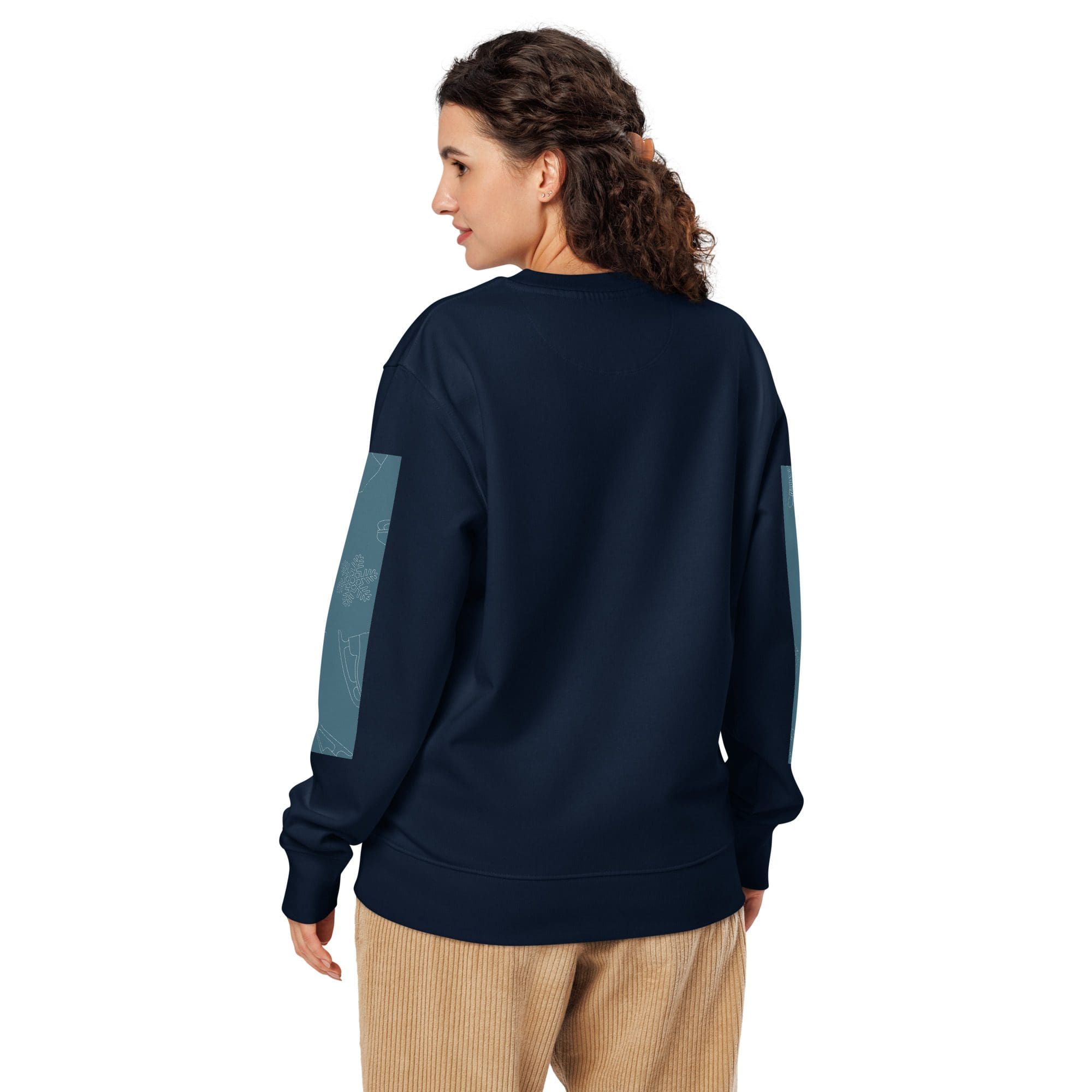 Woman wearing navy sweatshirt and corduroy pants.