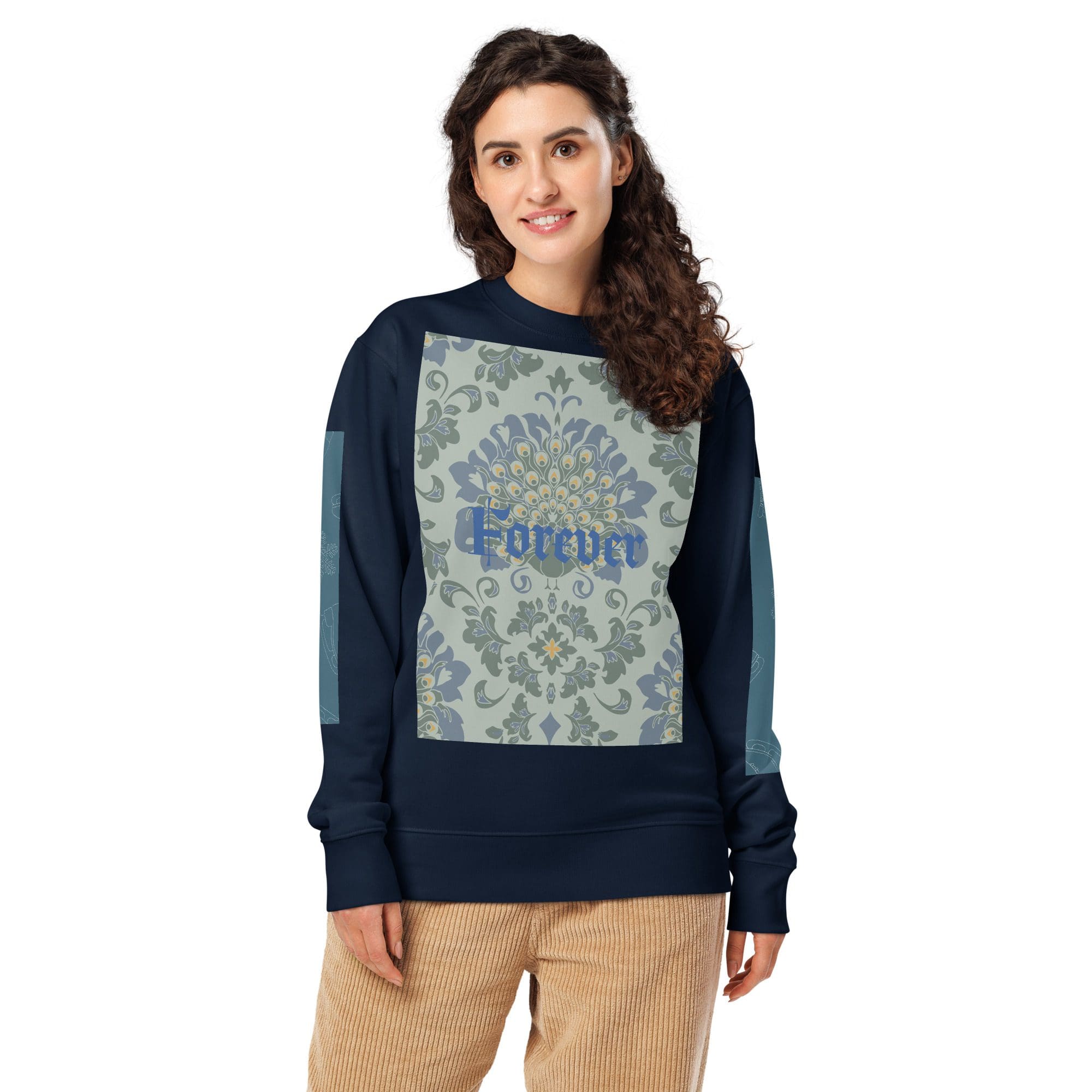 Woman wearing floral sweater and corduroy pants.