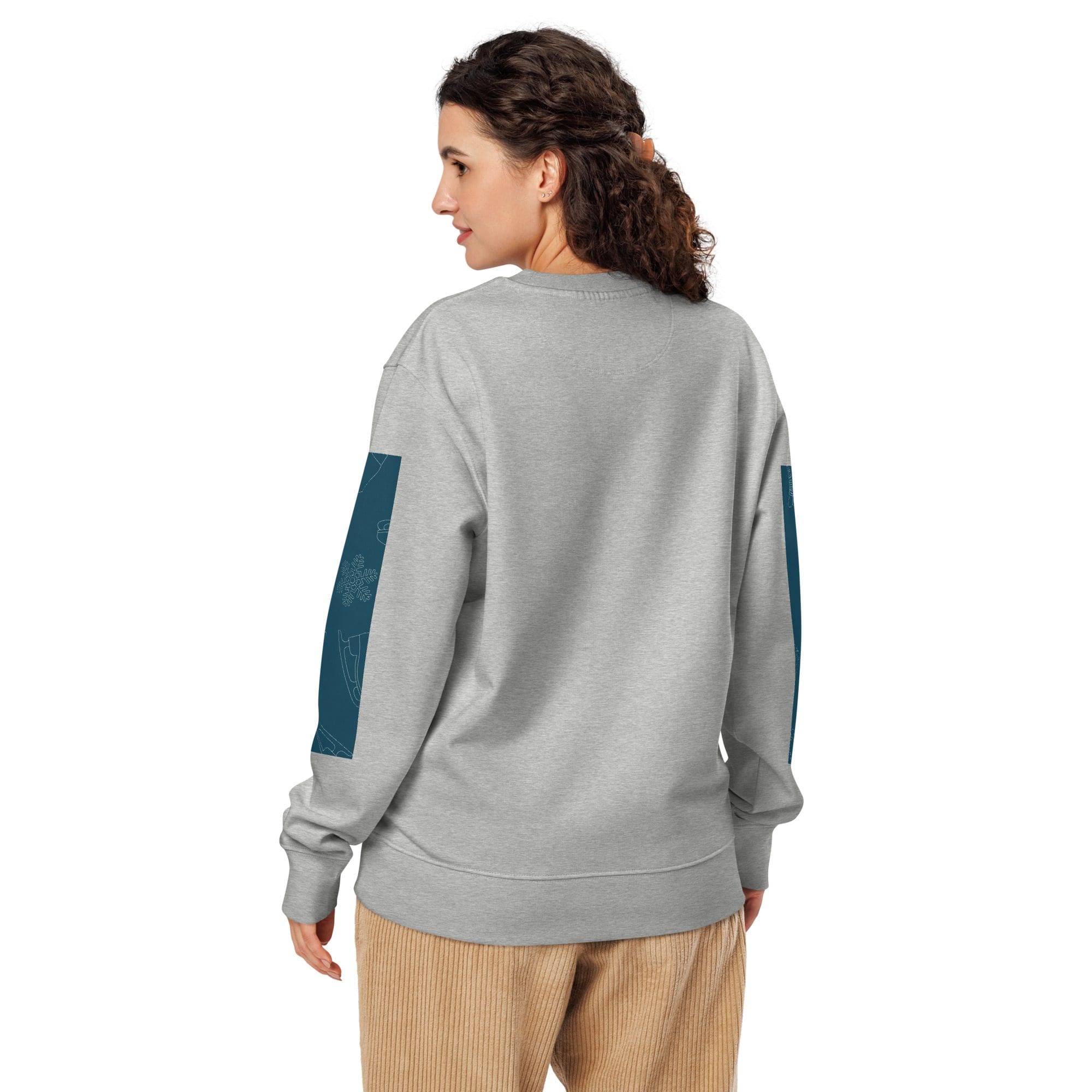Woman in gray sweatshirt with teal elbow patches
