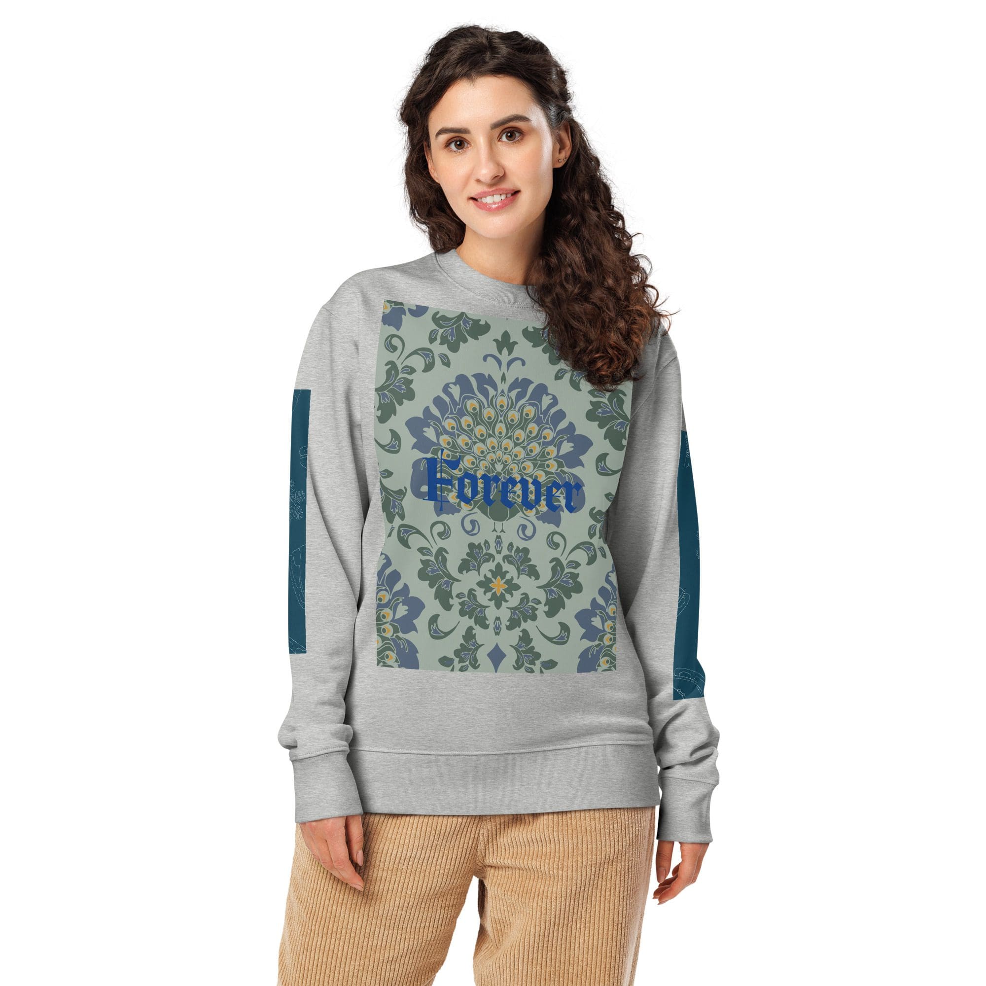 Woman wearing floral sweatshirt, smiling.