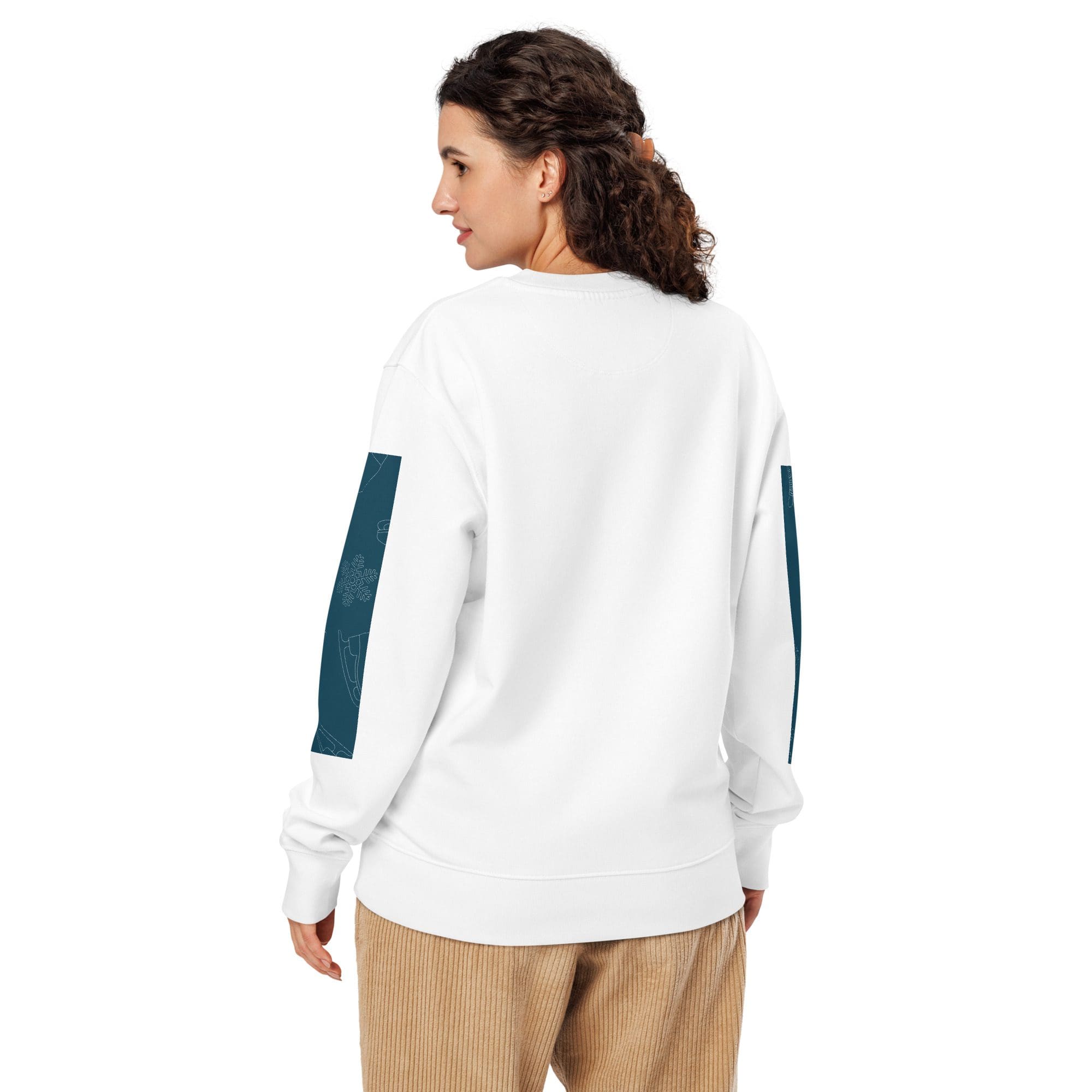 Woman wearing white sweatshirt, beige pants.
