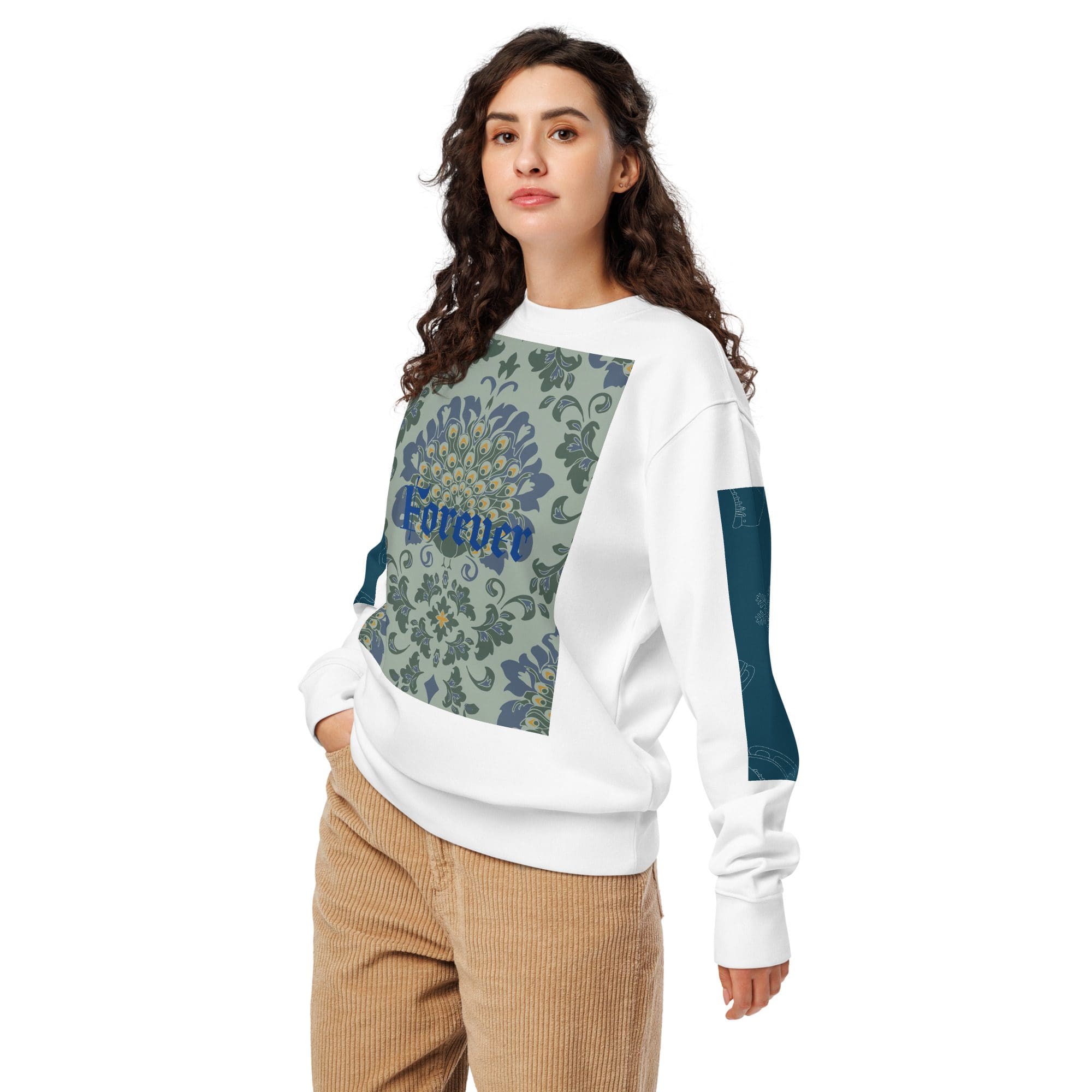 Woman wearing patterned white sweatshirt, beige pants.